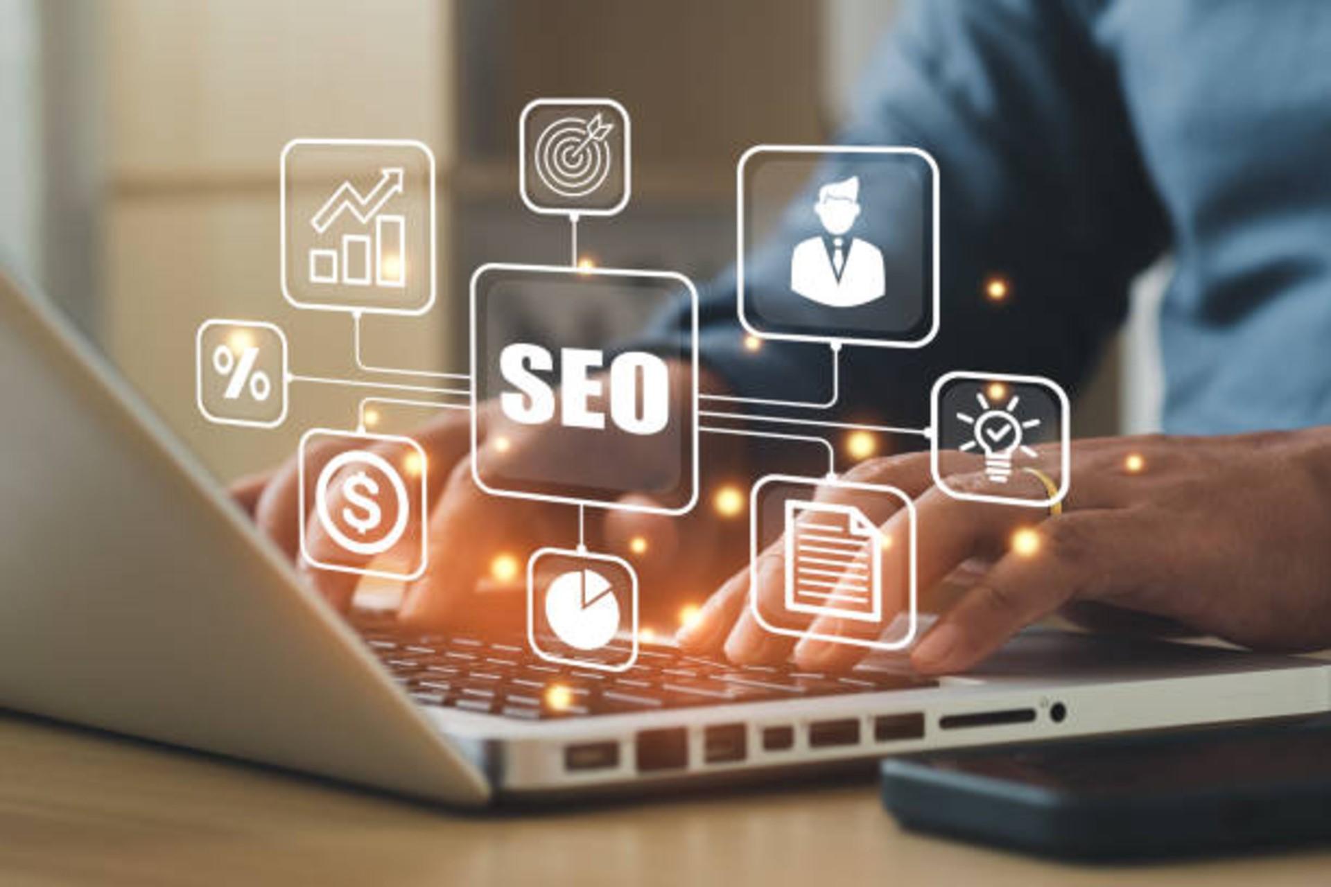 A man using a laptop for SEO marketing