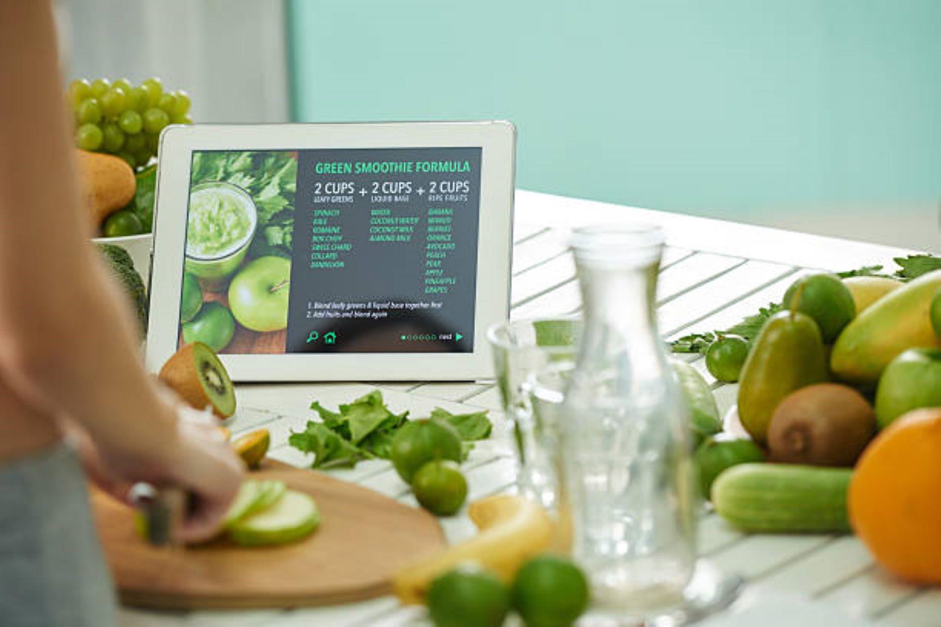A woman reading the recipe online on a tablet.