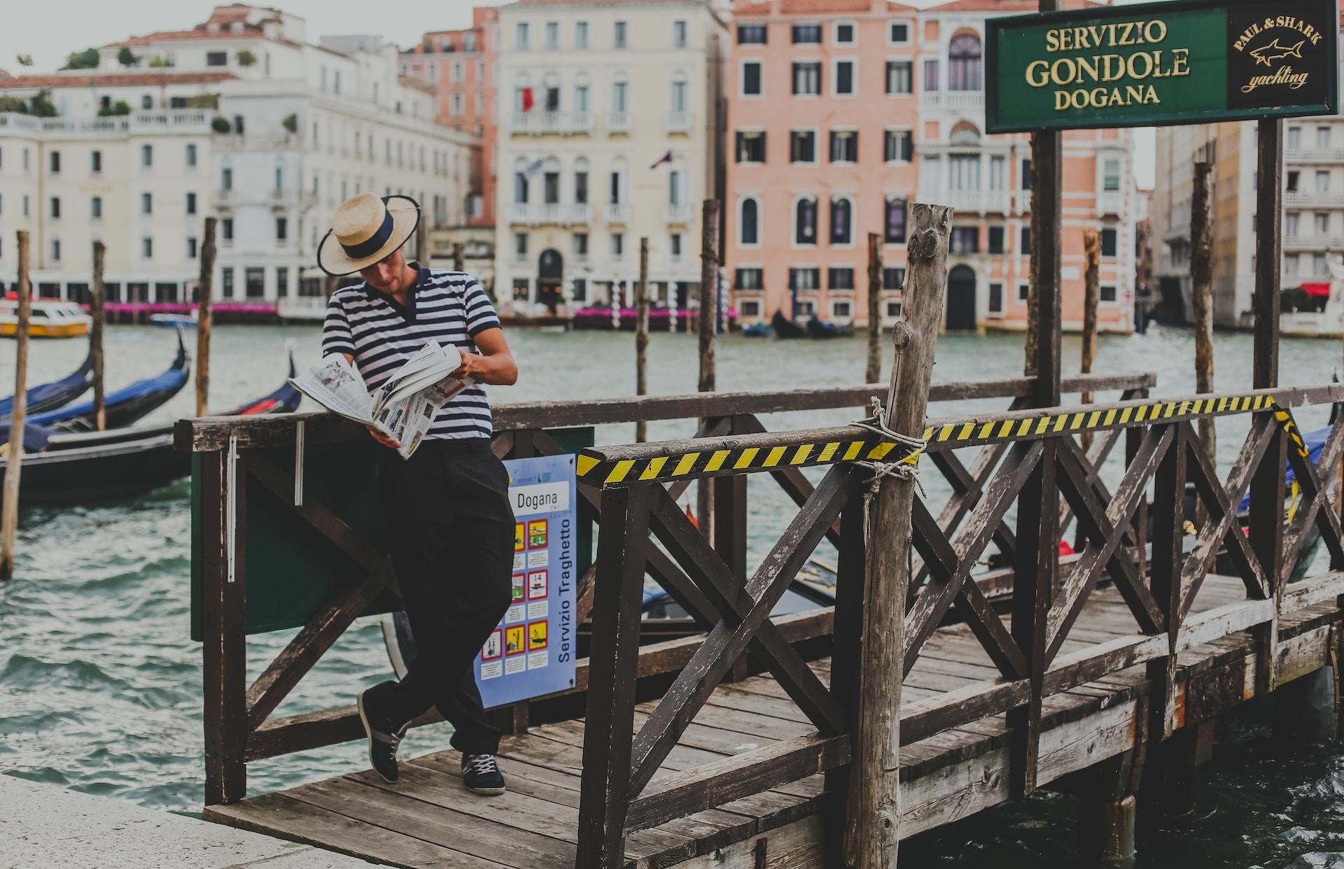 Man reading the newspaper in Italy.