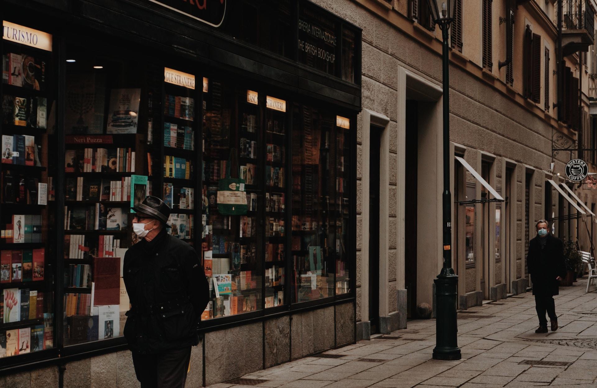Man passing by an Italian library.