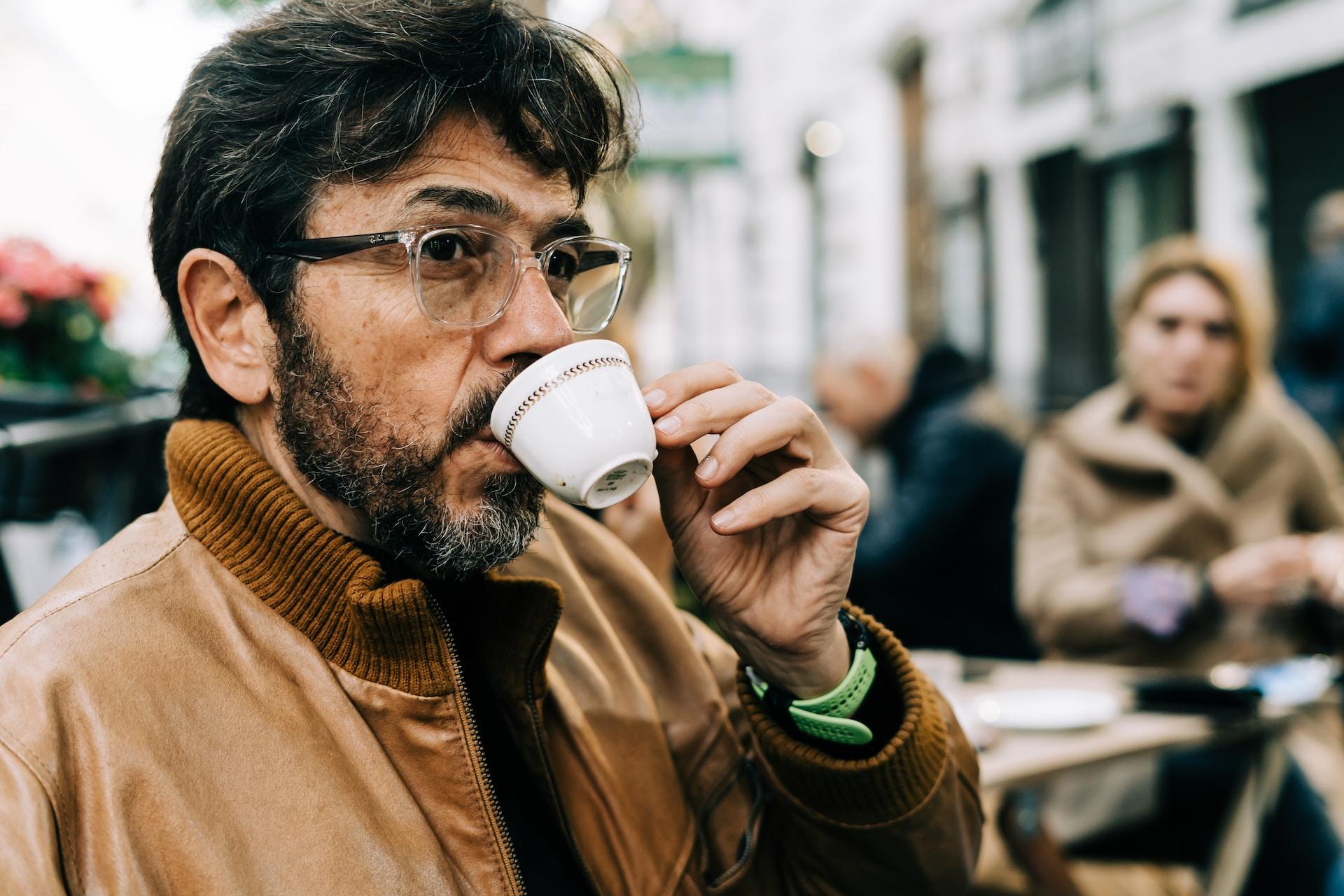 Italian man drinking espresso.