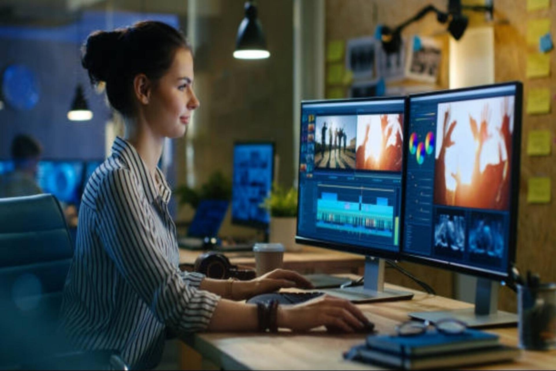  A content creator editor working on a computer.
