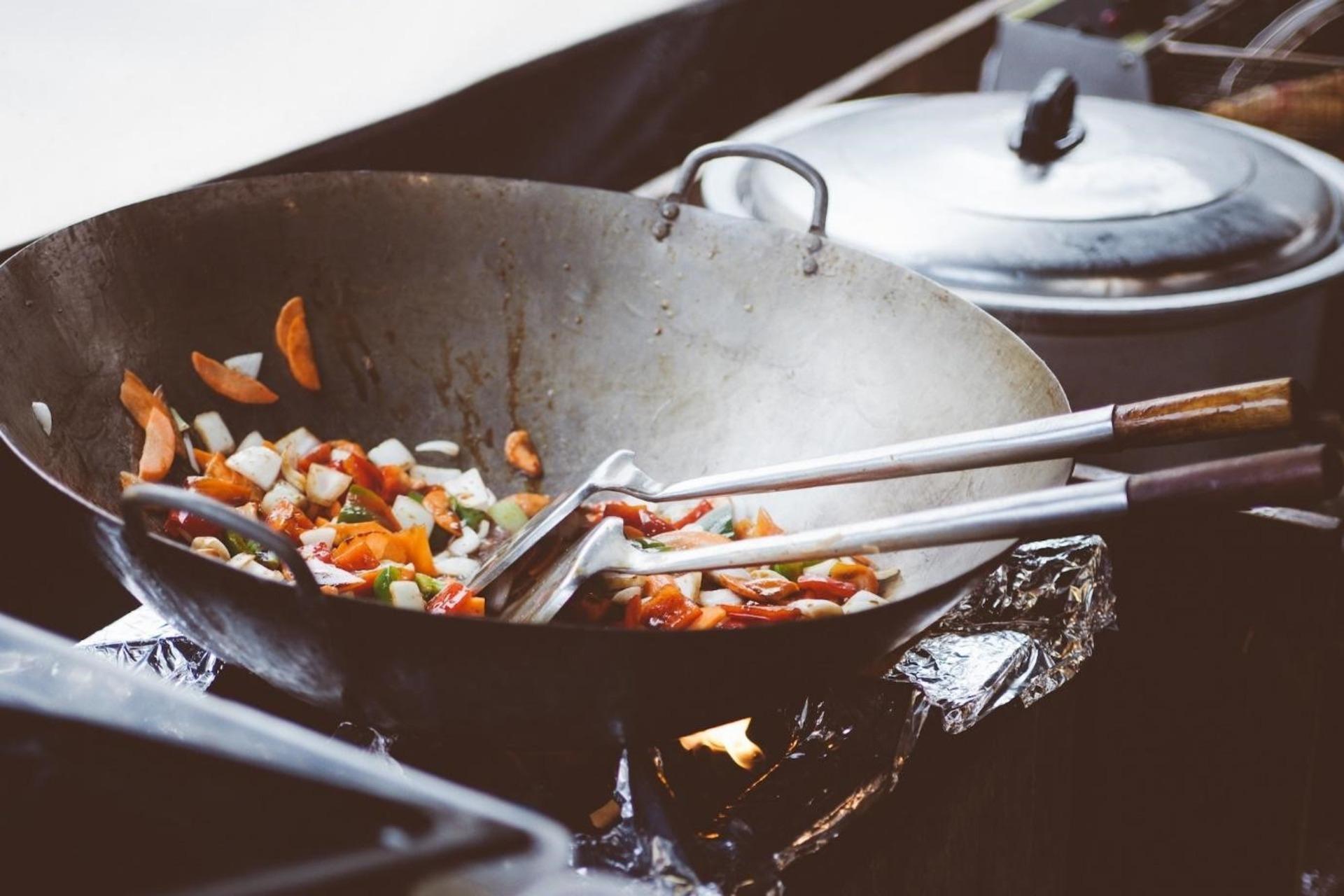 Vegetables sautéing in a wok