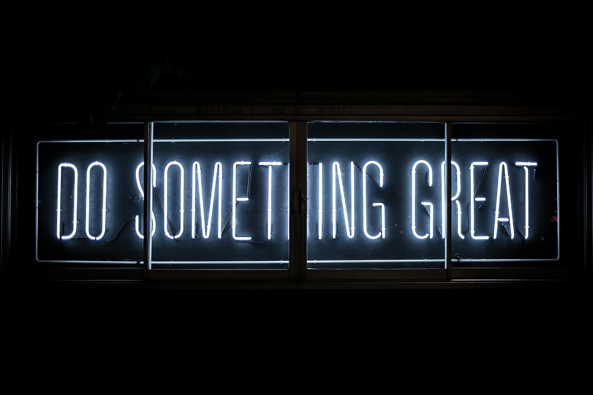 Neon panel of citation "do something great".