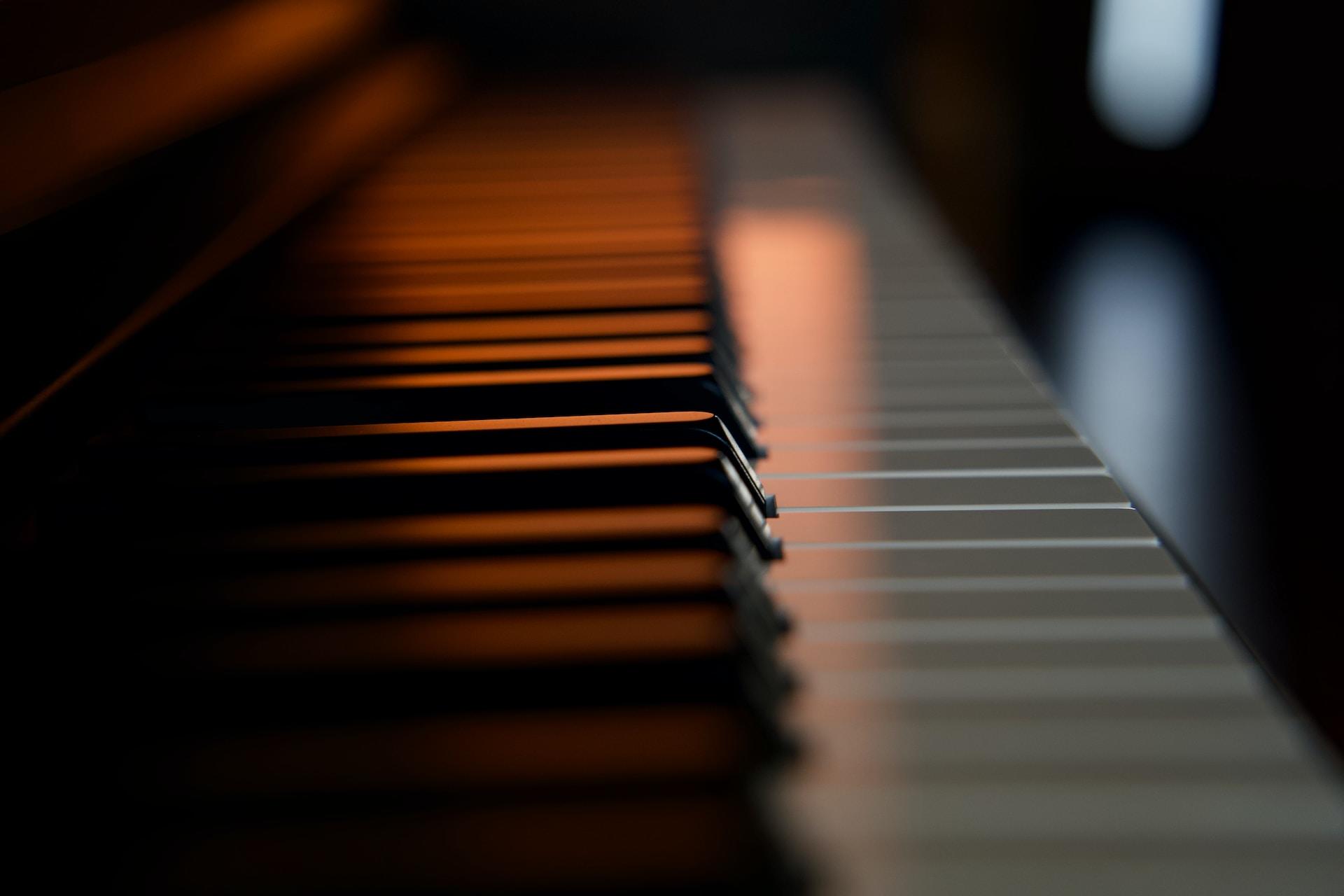 A closeup of the keyboard on a piano.