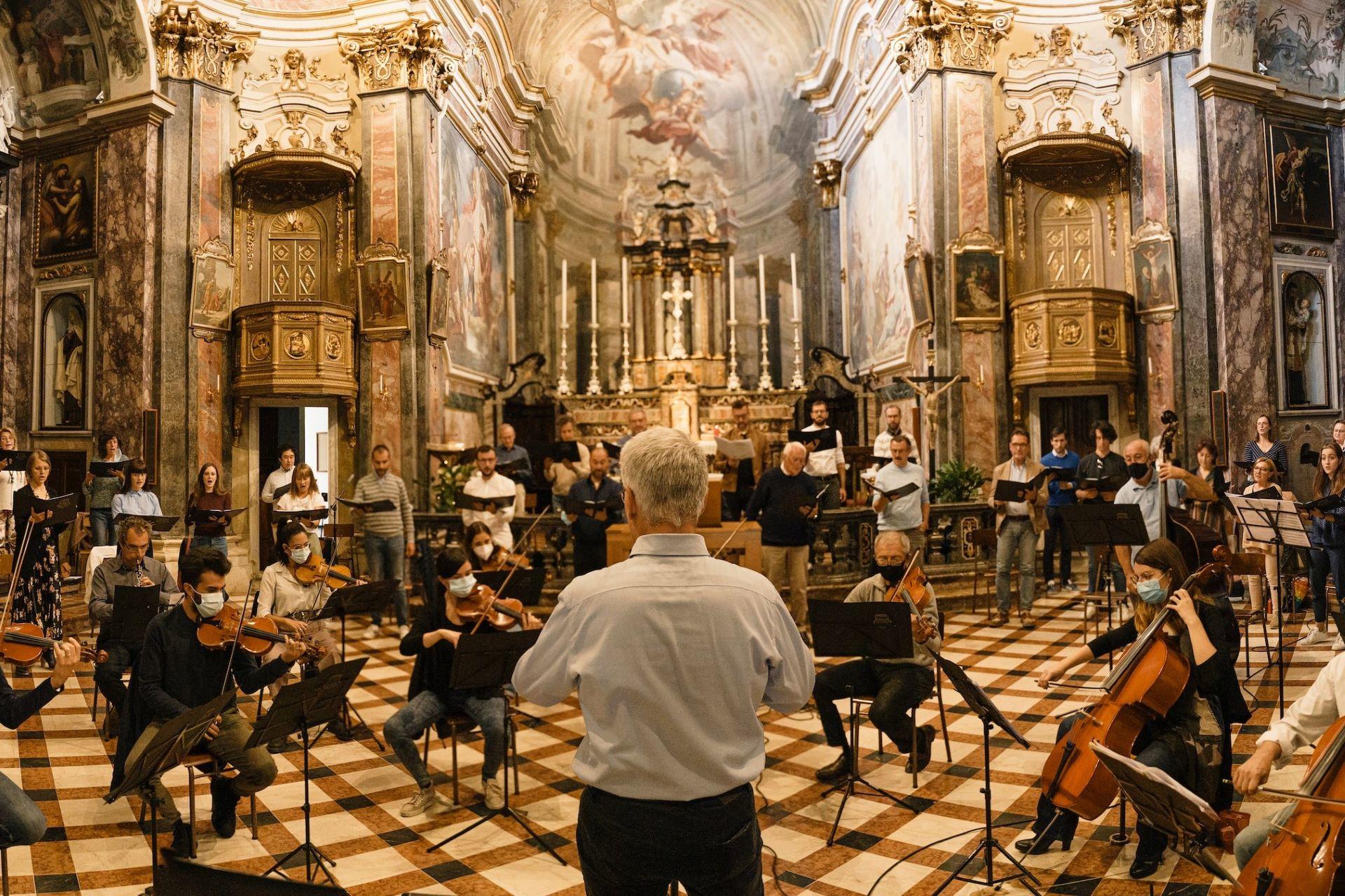 An orchestra performing in a church.