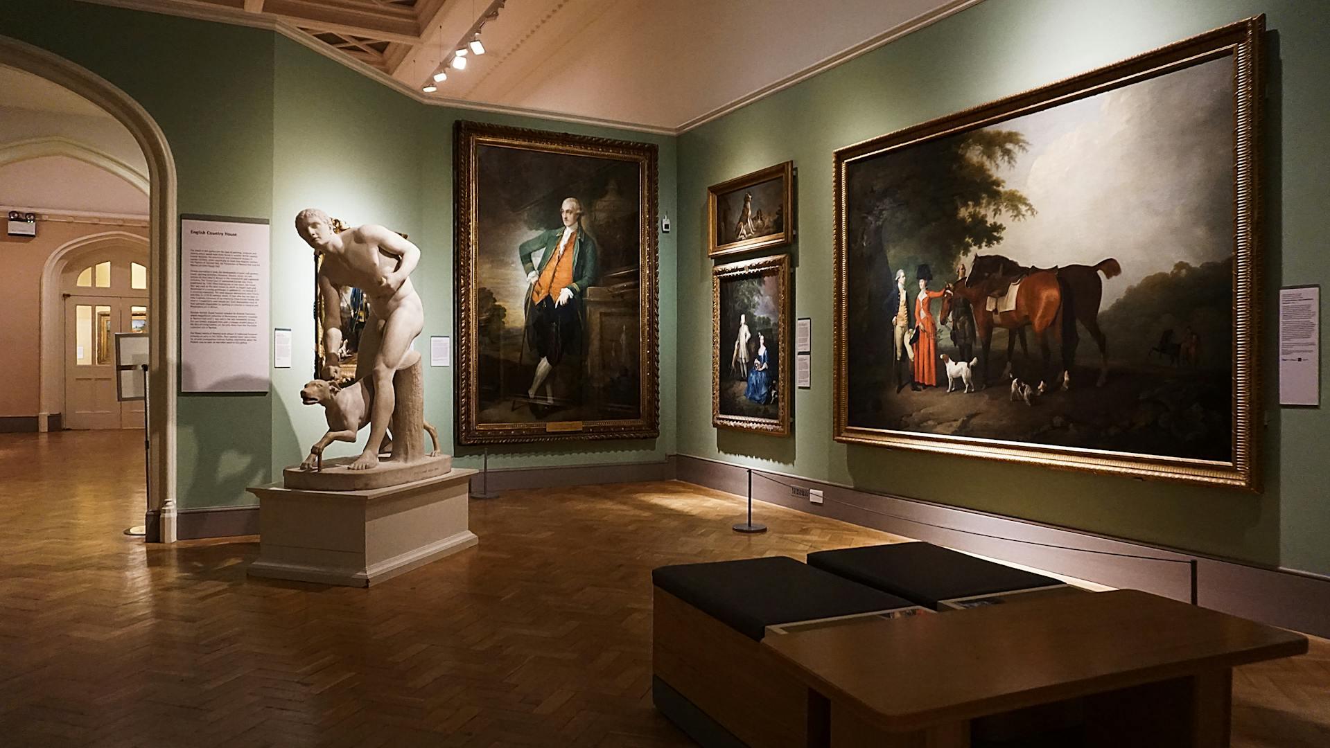 a curated arrangement of paintings and sculpture in a museum