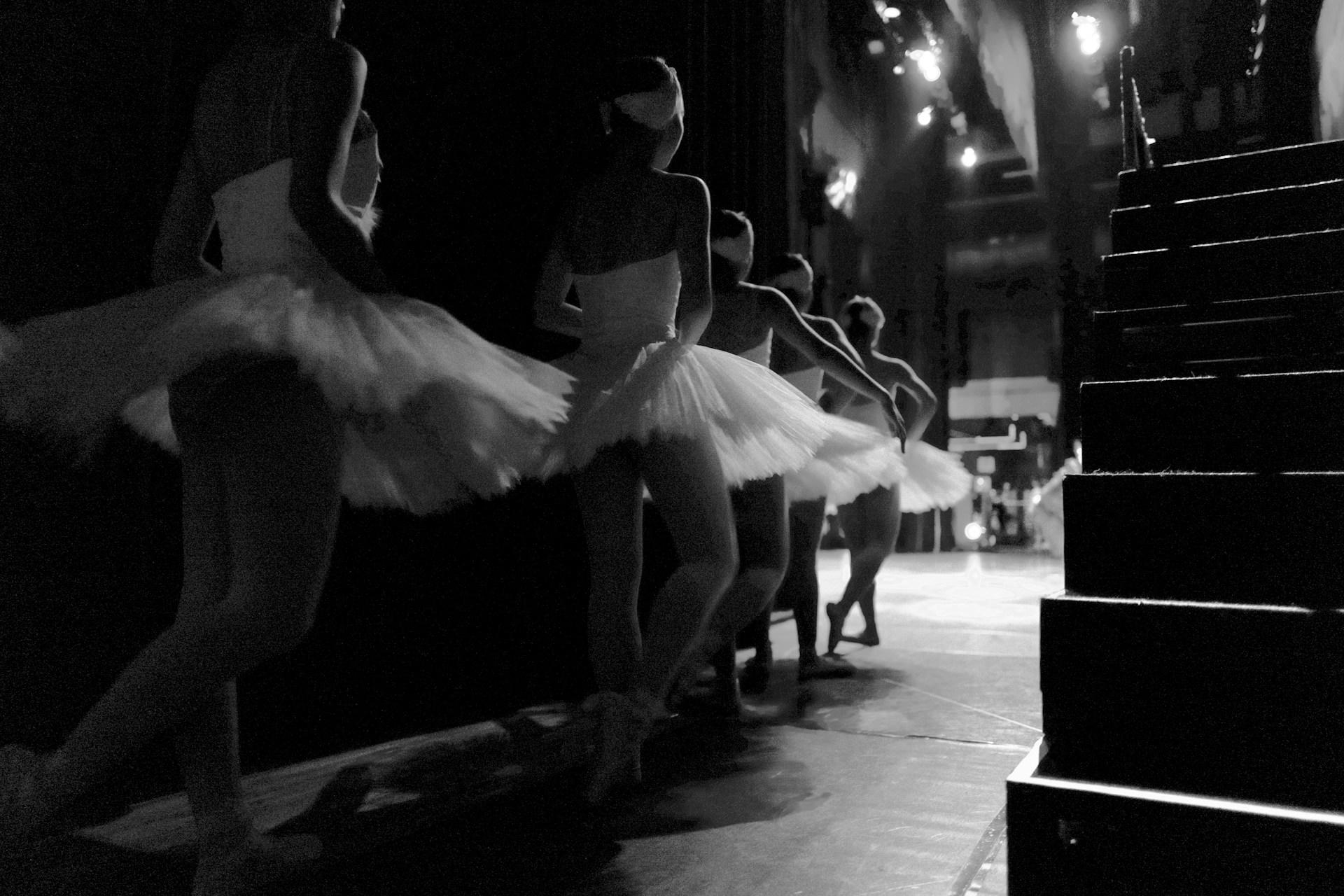 Ballet dances behind the stage, waiting to go on.