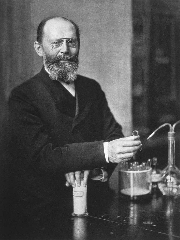 Emil Fischer in a science lab conducting an experiment.