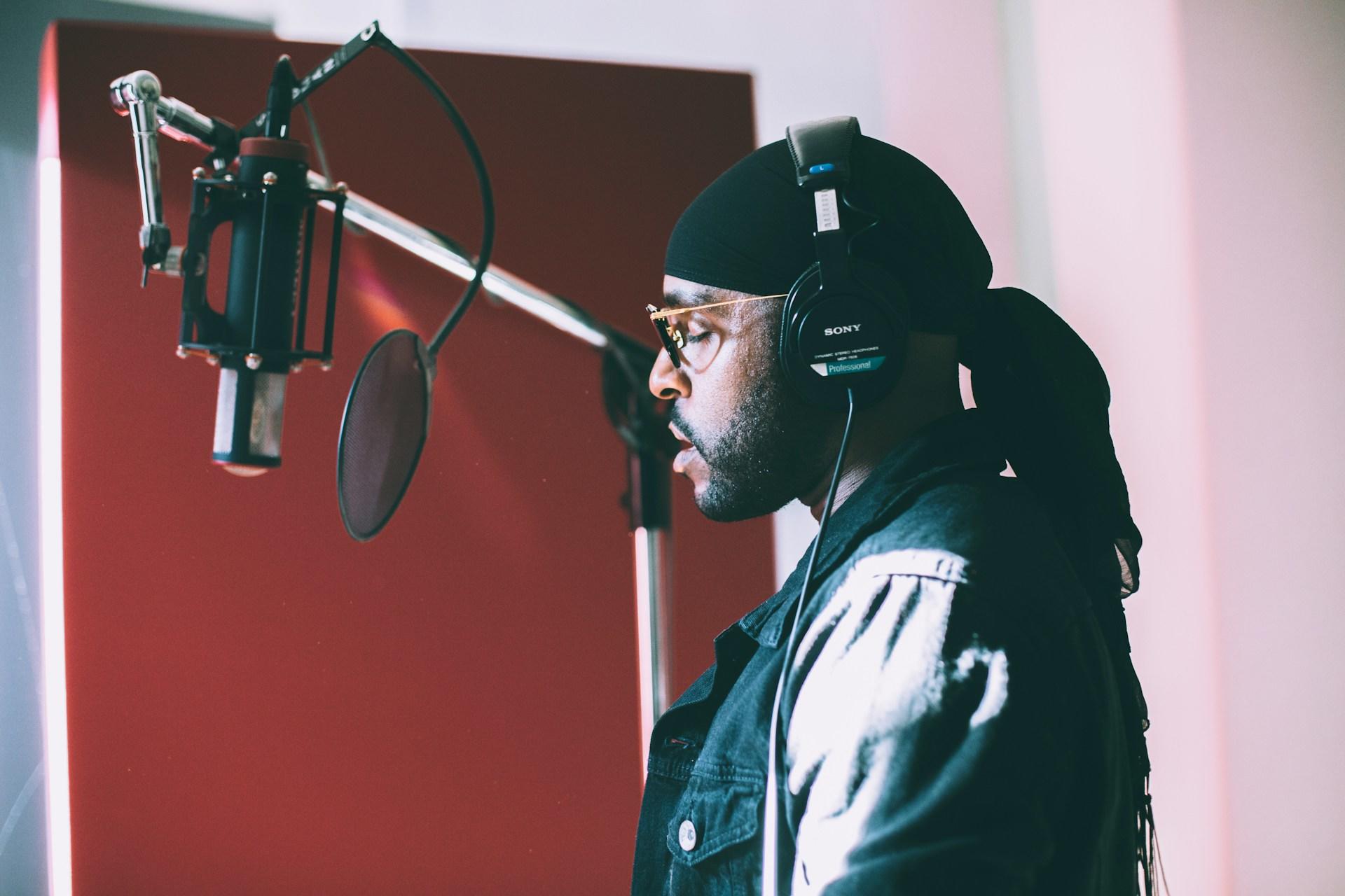 A rapper in front of a mic