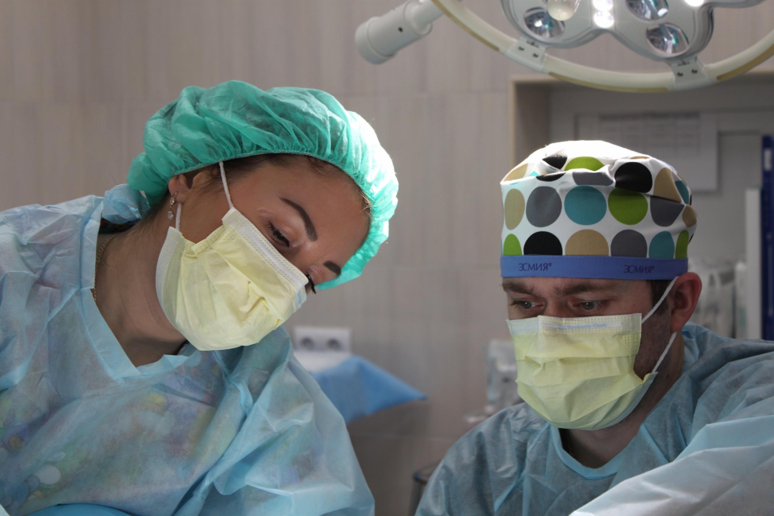 A nurse helping a patient.