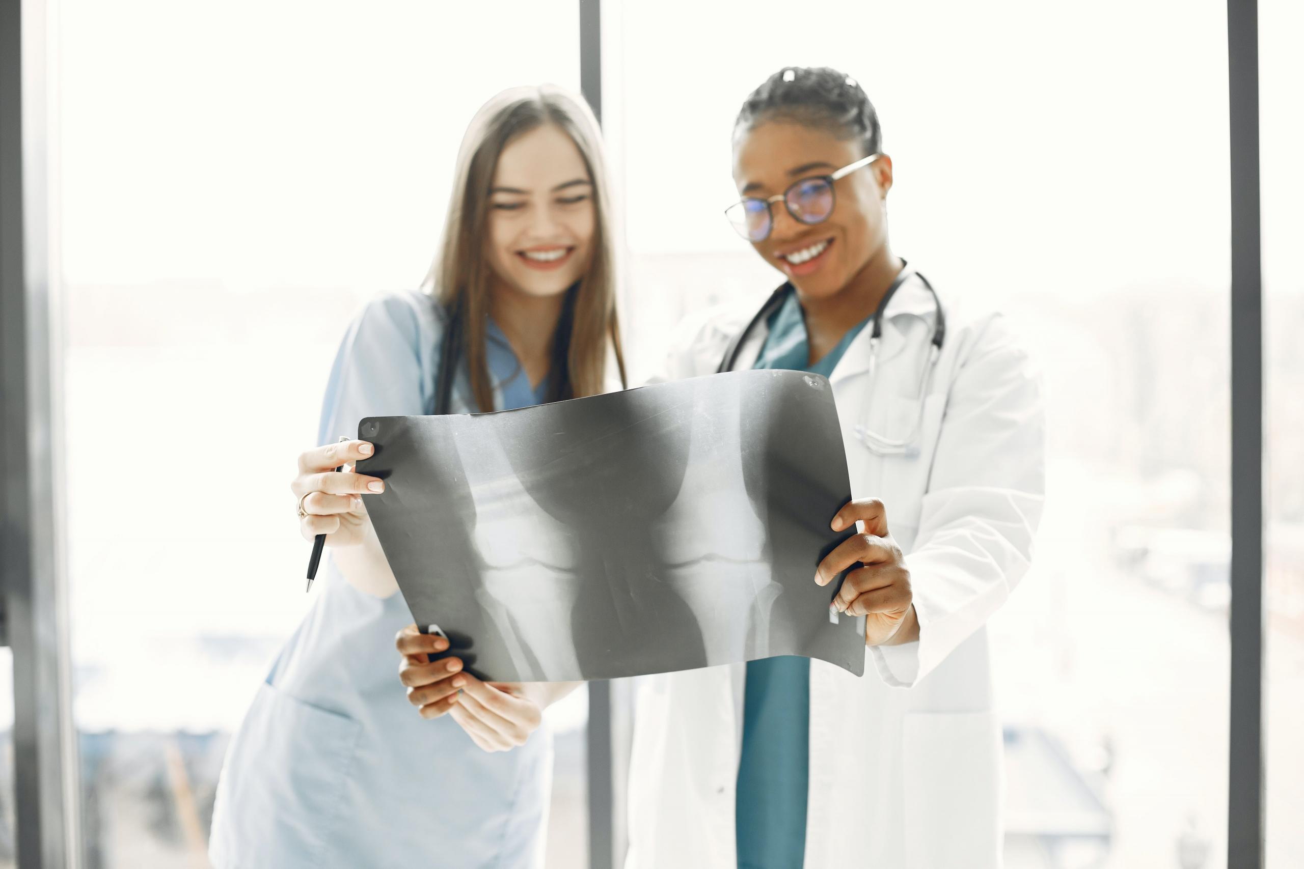 A Doctor and a nurse collaborate in their work.