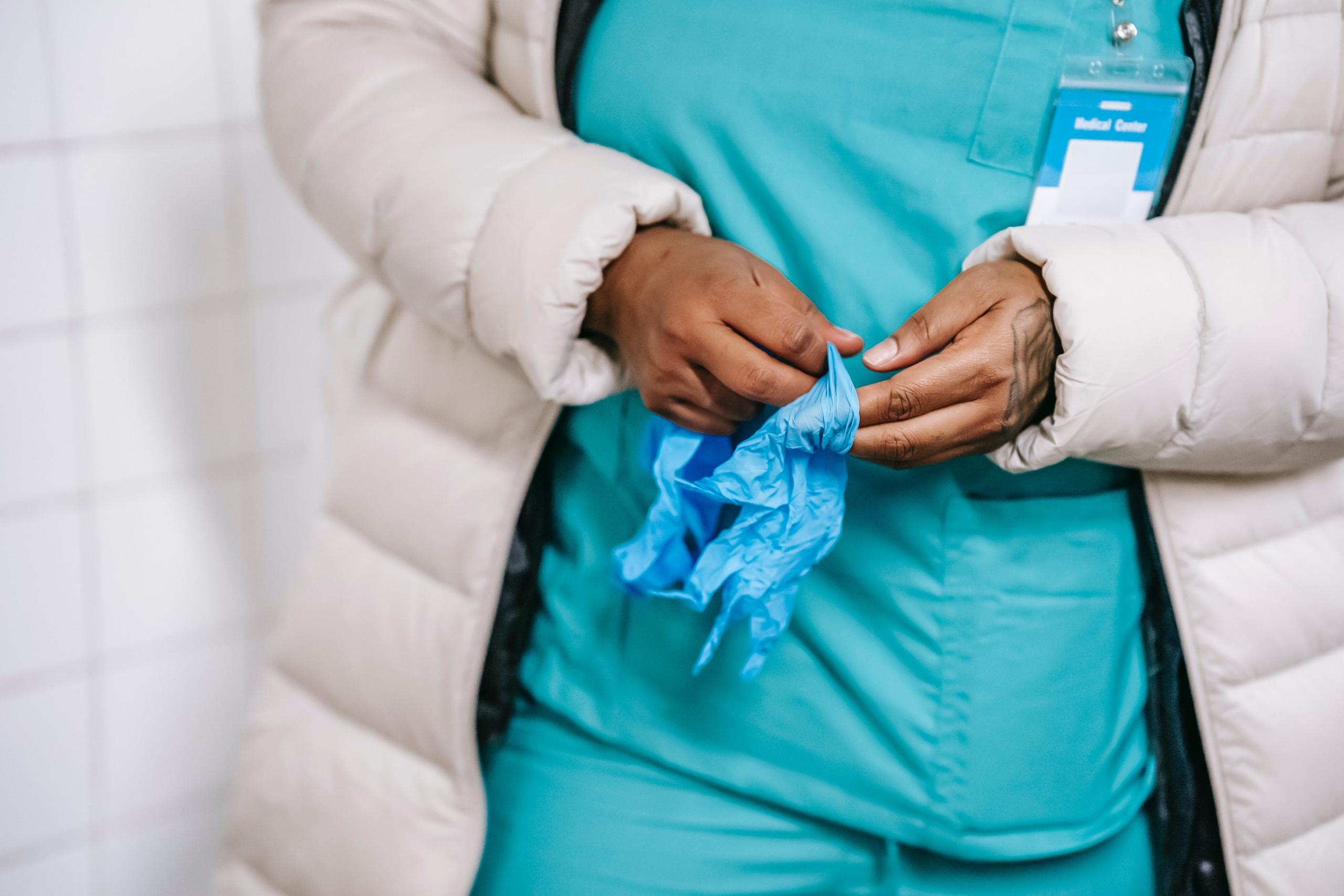 A nurse getting read for work.