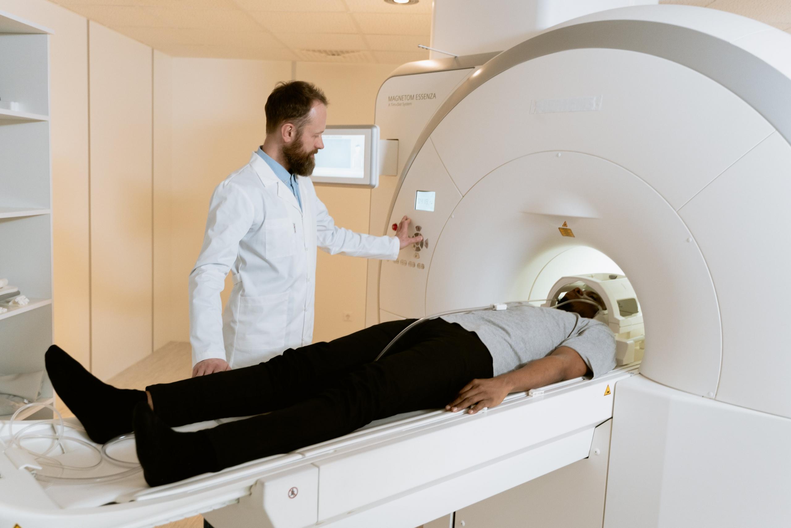 A Nurse accompanying a patient through an x-ray.