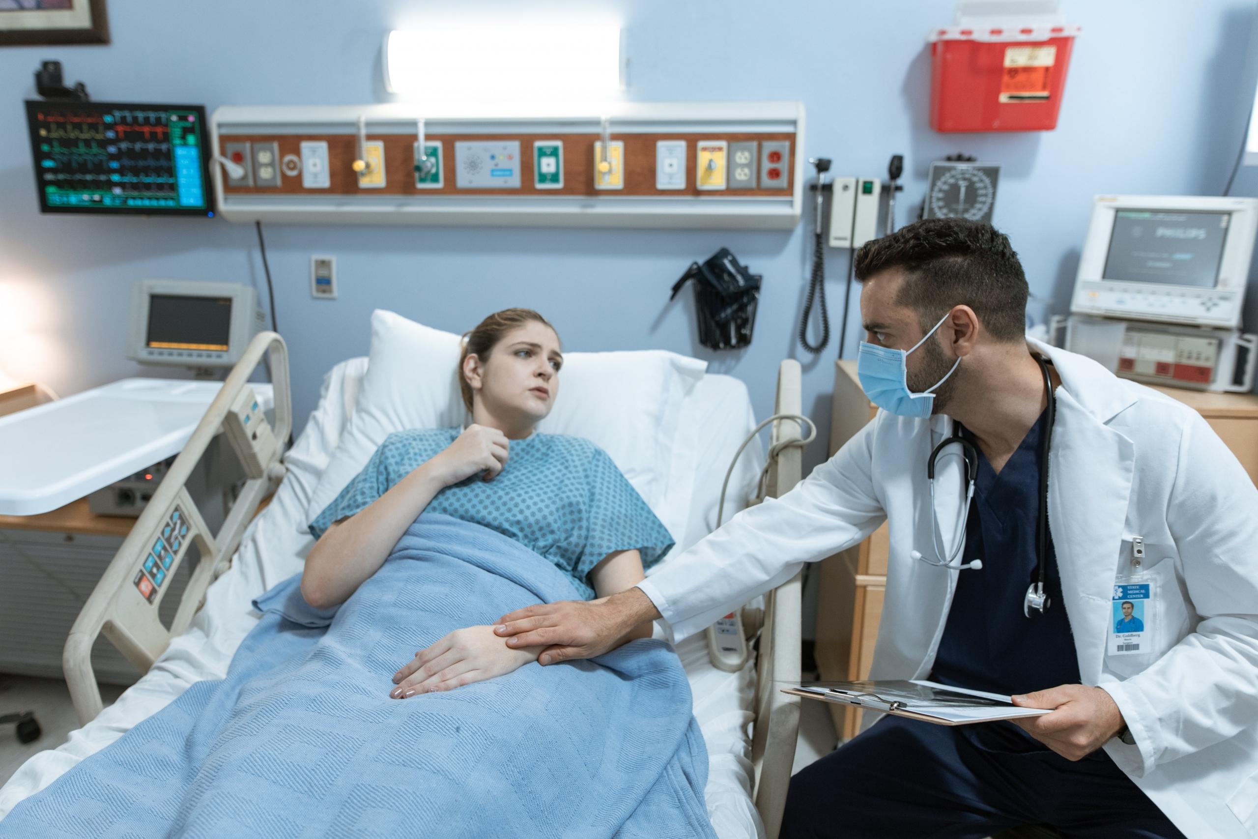 Looking after a patient in the hospital.