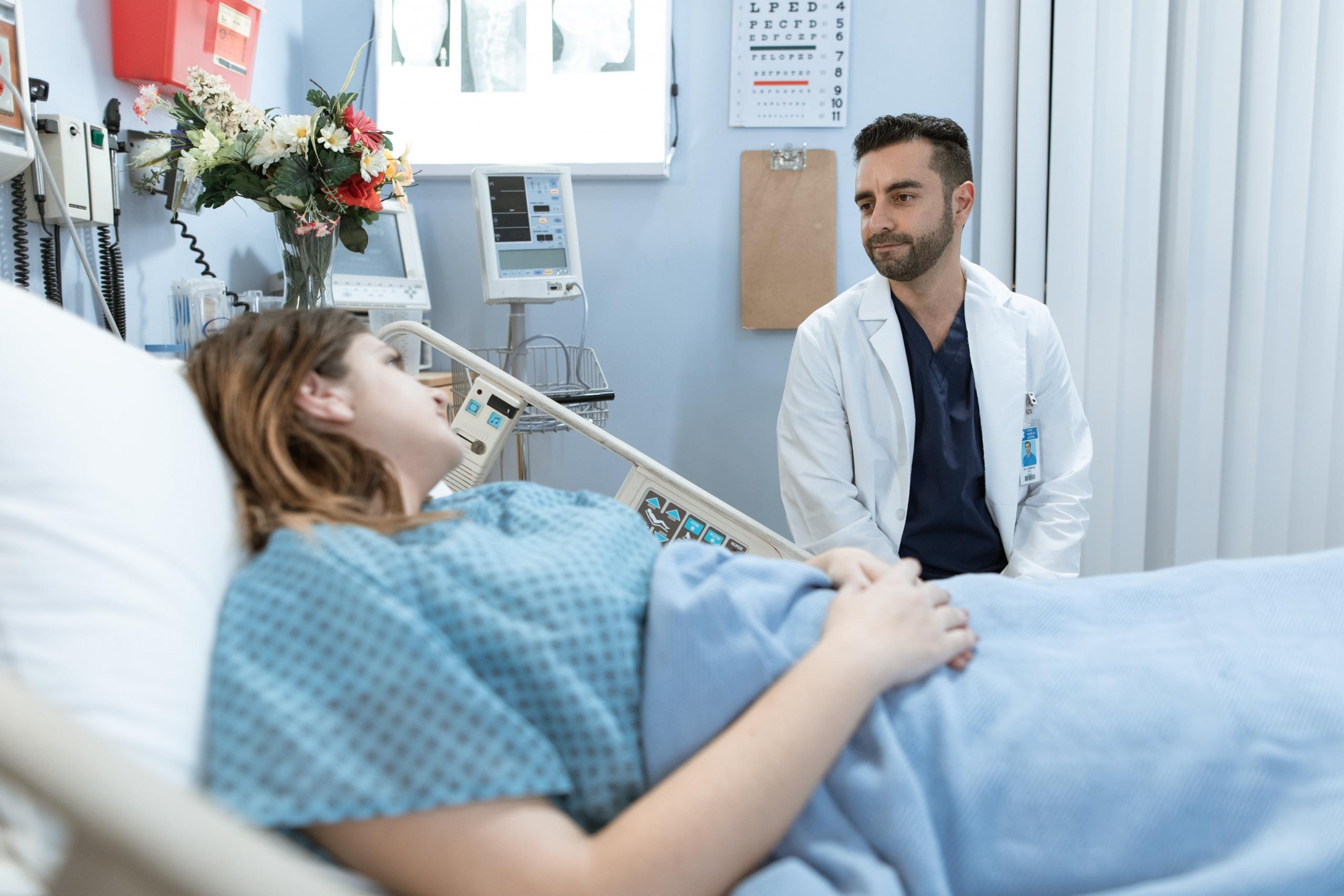 A nurse visiting patients in the hospital.