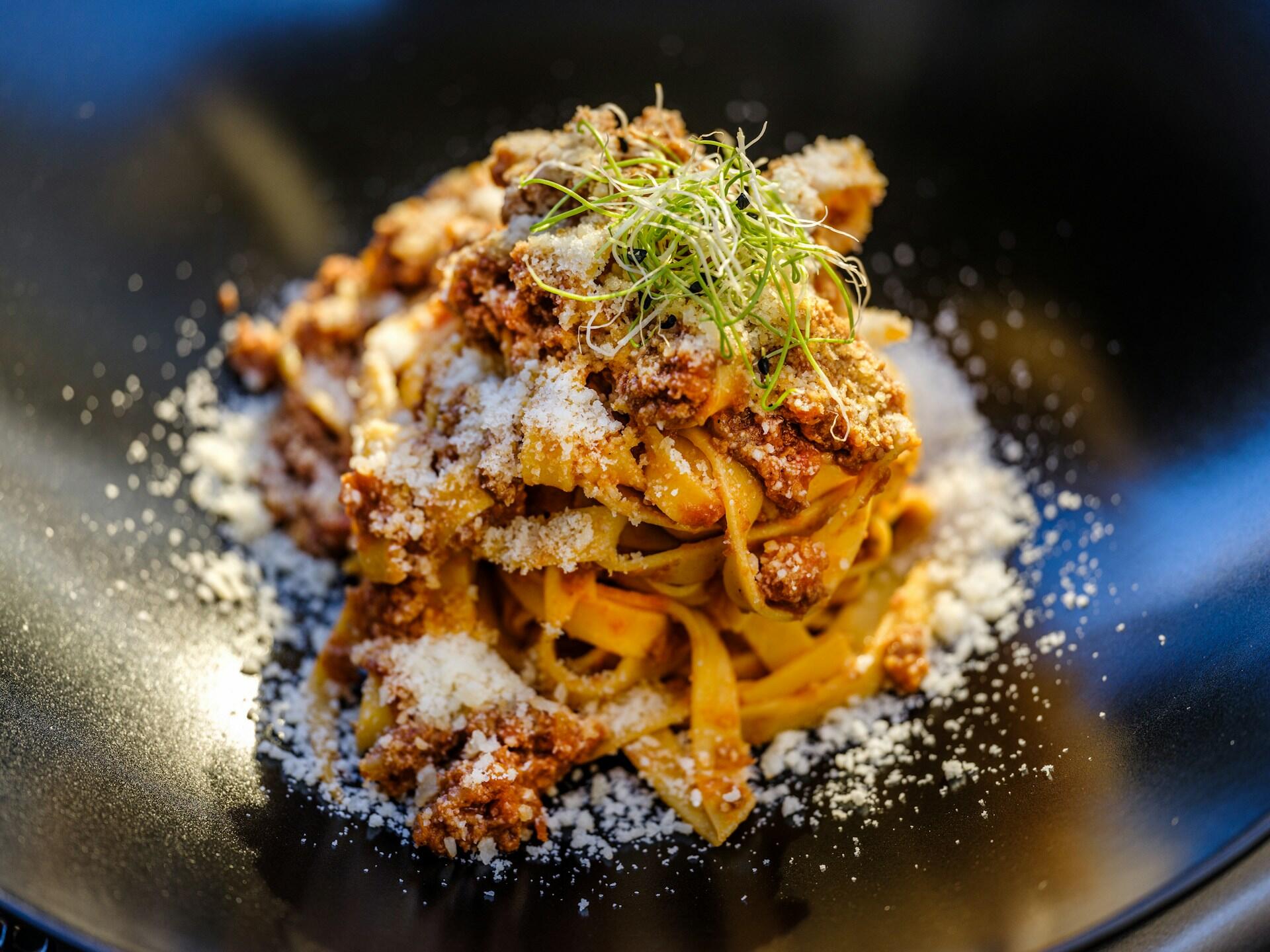 Ragu alla bolognese with parmesan on top.