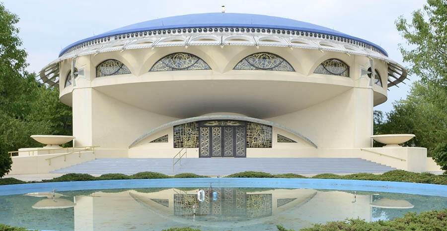 Annunciation Greek Orthodox Church with its architectural details under clear skies.