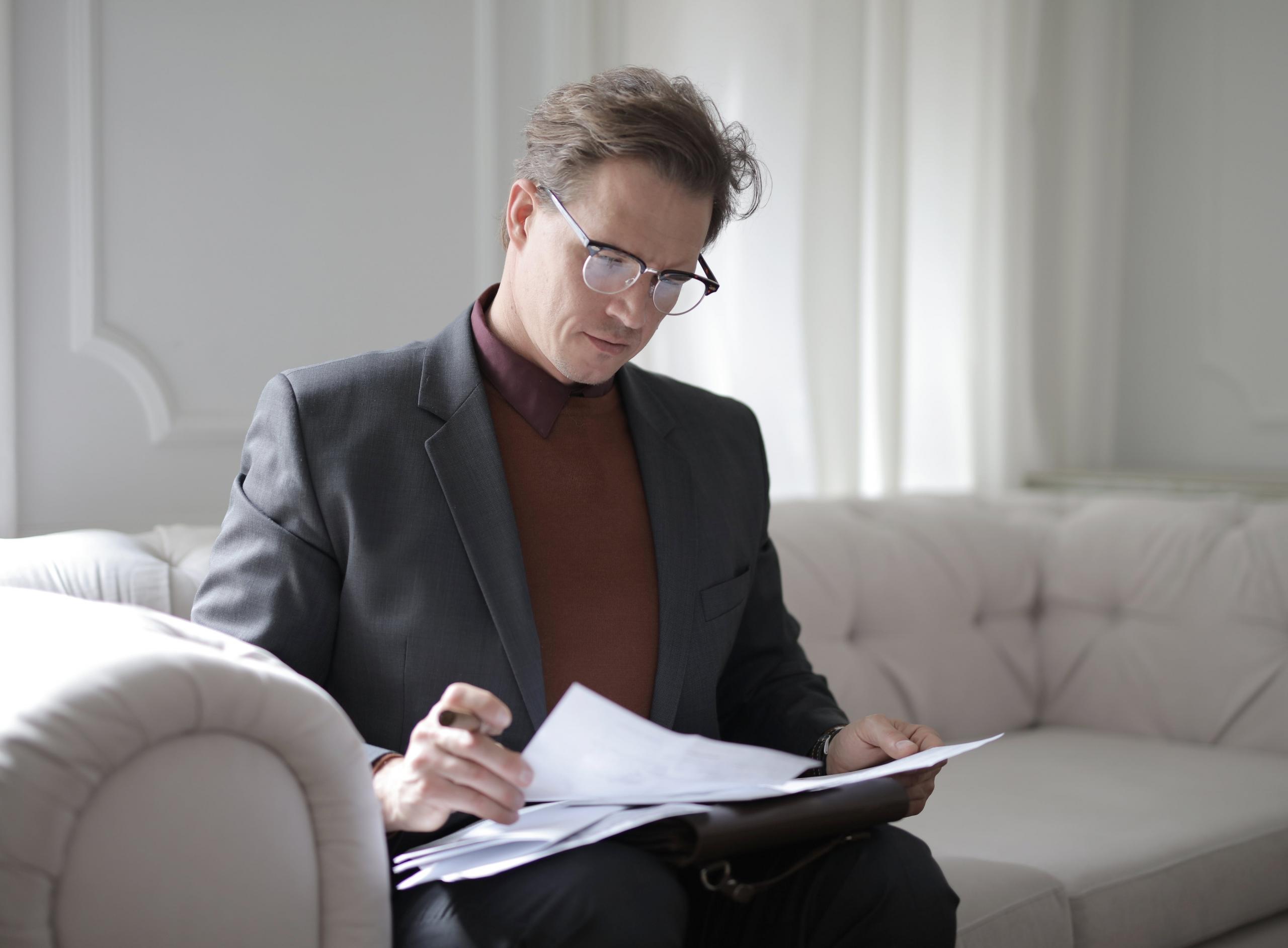 A man reviewing financial documents.