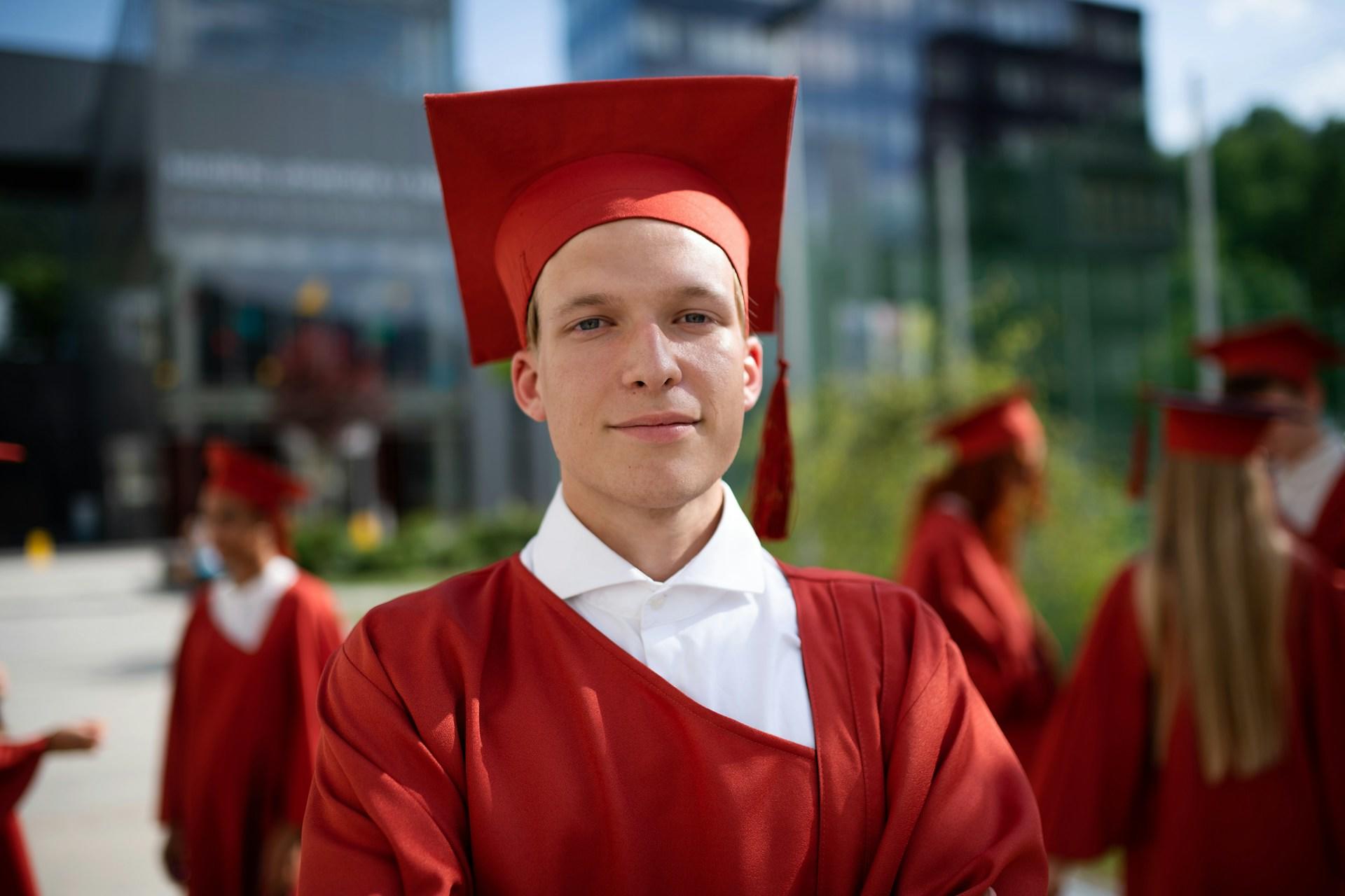 A guy at his high school graduation.
