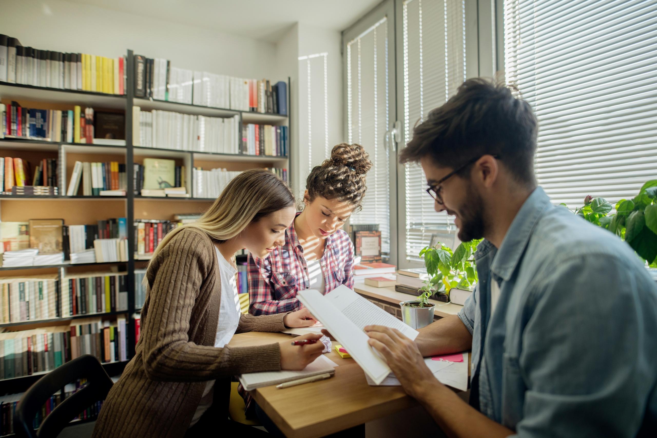 A group of studying studying together for an upcoming test.