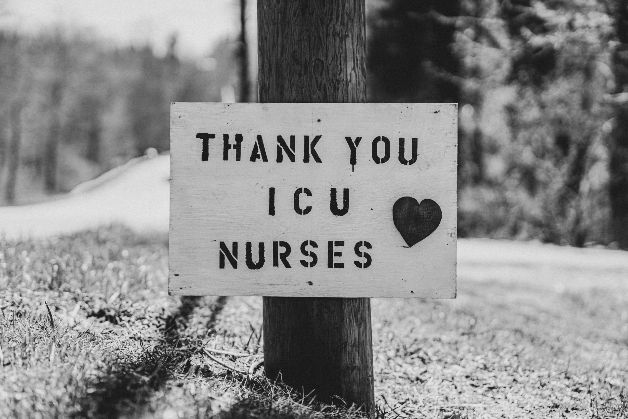 A sign on a tree, thanking ICU nurses.