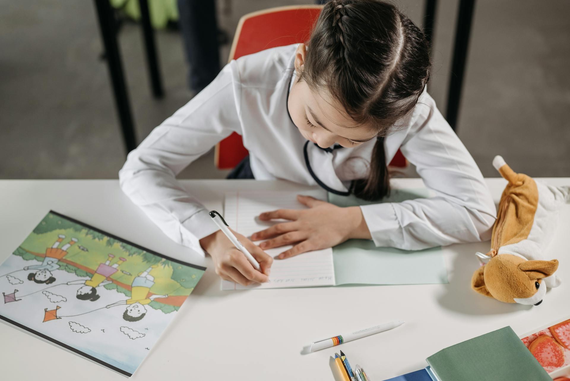 A girl doing their homework.