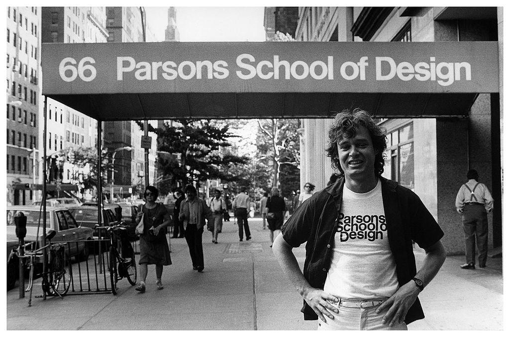 A black and white photograph of a man (Joseph Cals) standing in front of the Parsons School of Design in 1980