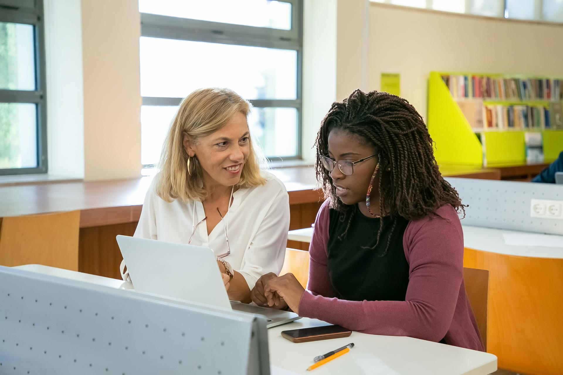 A private tutoring session in a library.