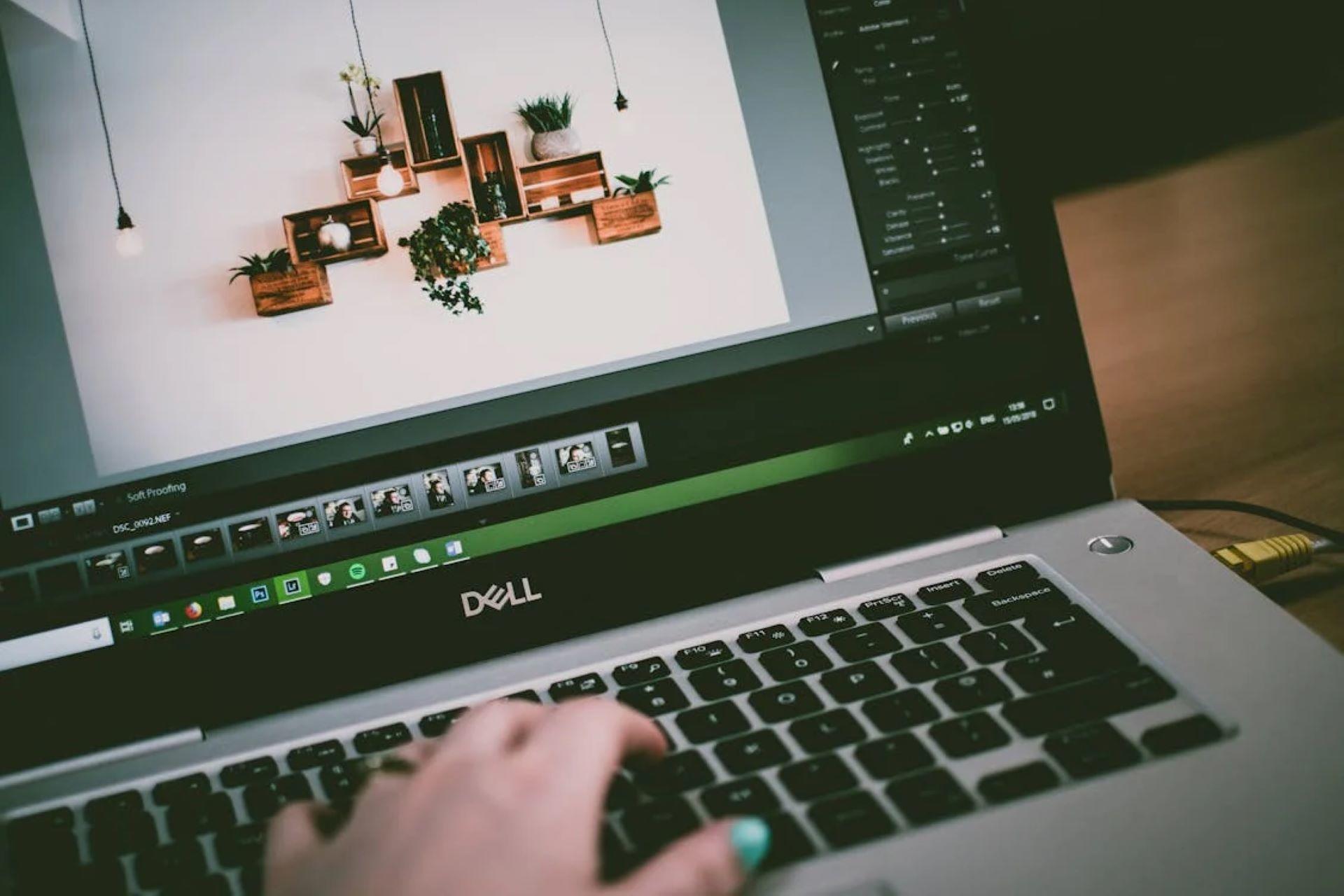 A person editing a photo on a laptop