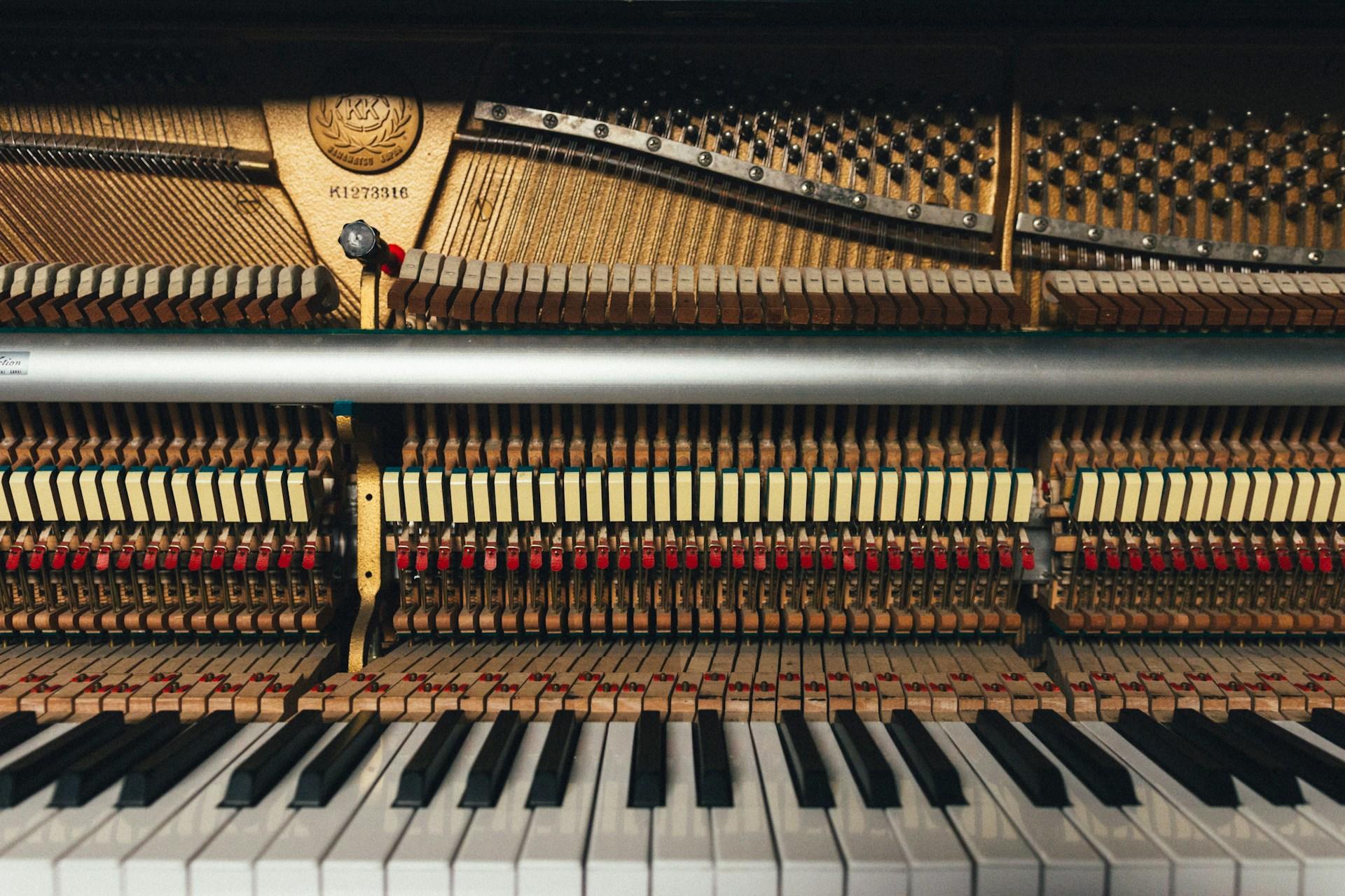 A piano with all the inner workings visible.
