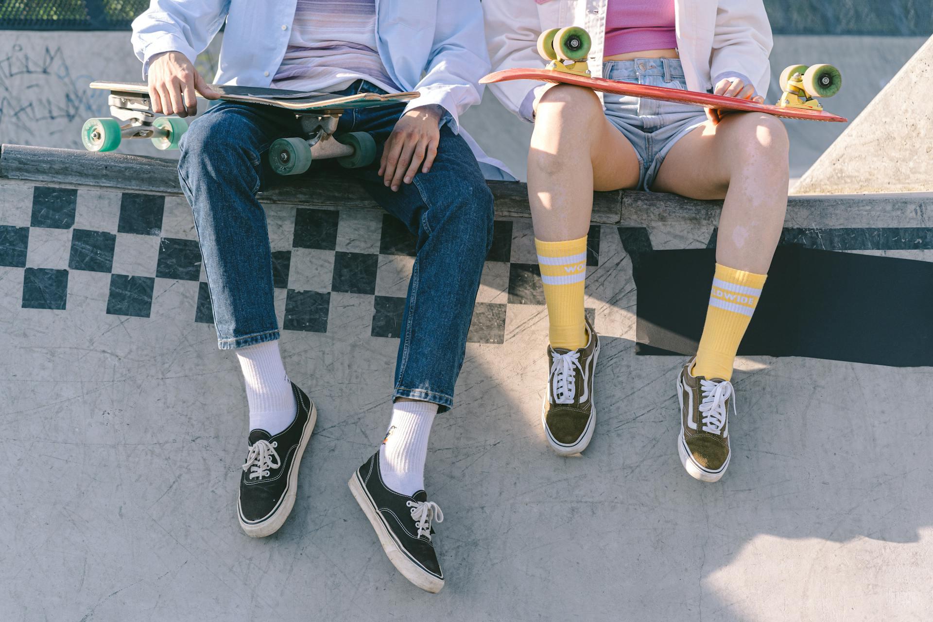 Two skaters wearing different clothing