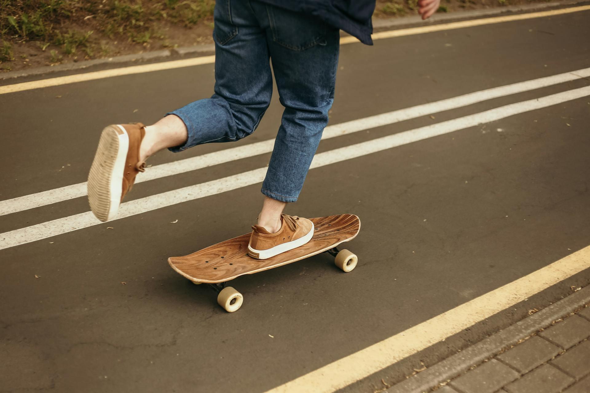 A skater pushing their board with their left foot