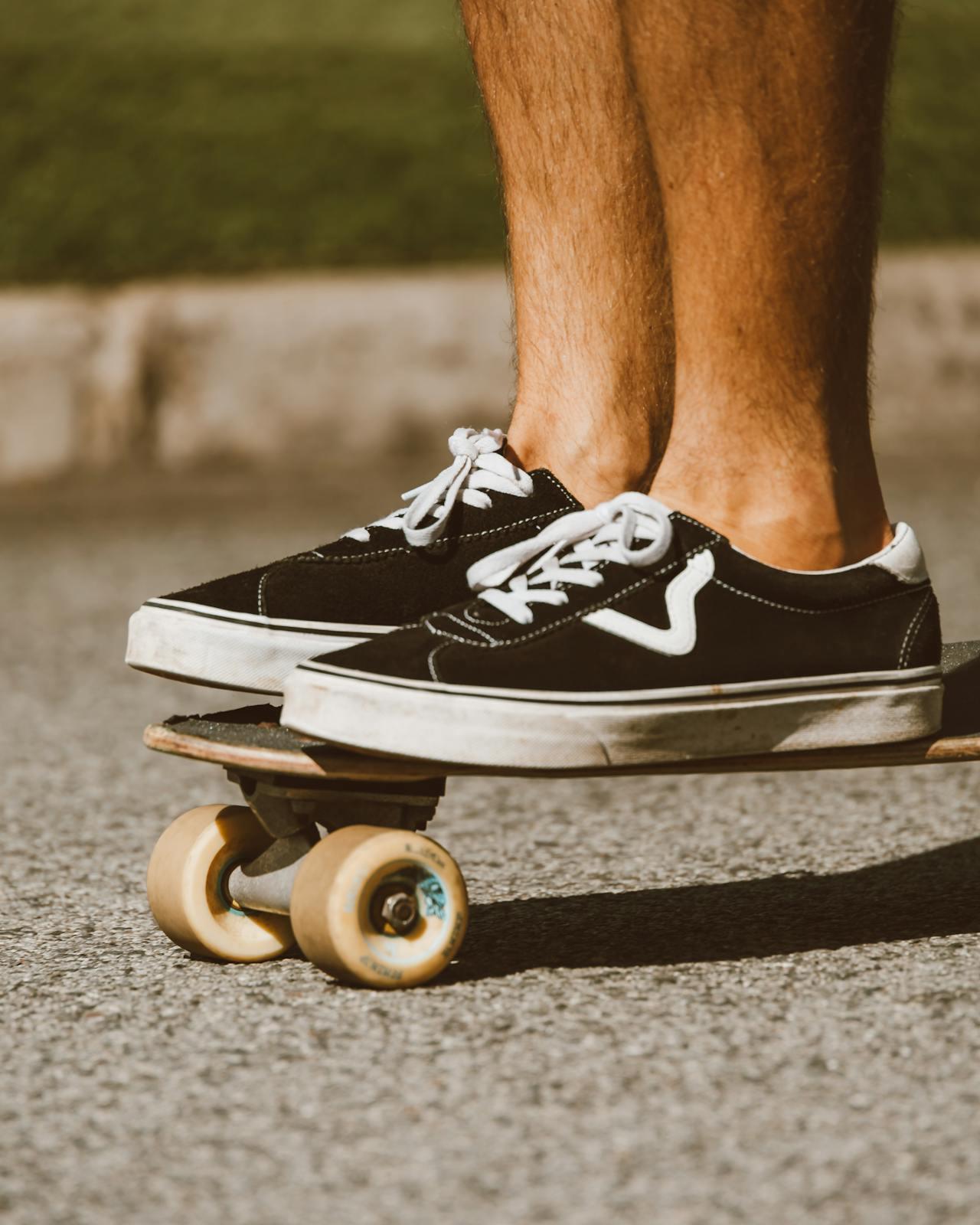 A skater wearing skateboard shoes on a board 