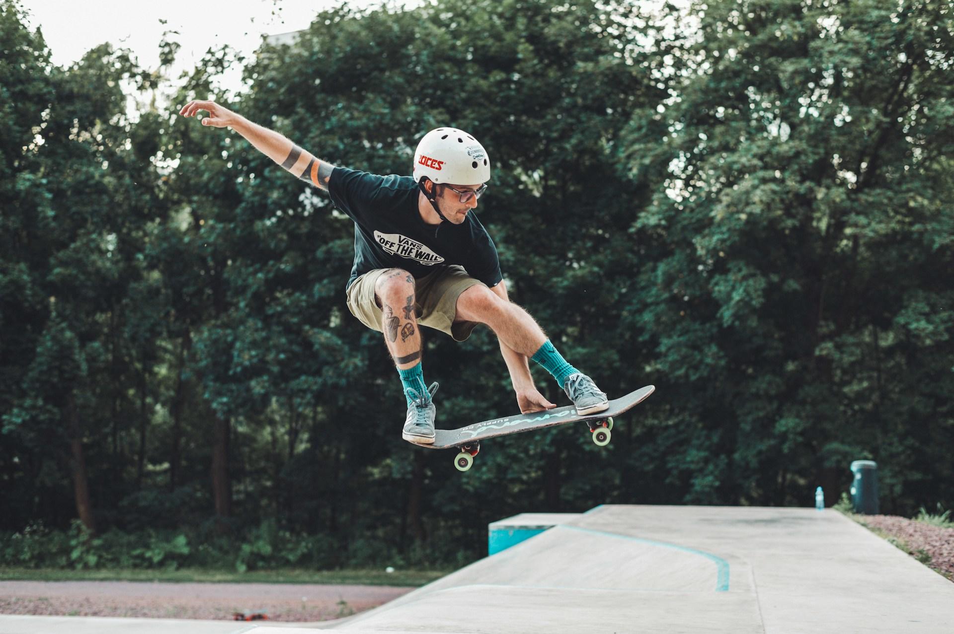 A skateboarder doing a jump on a ramp