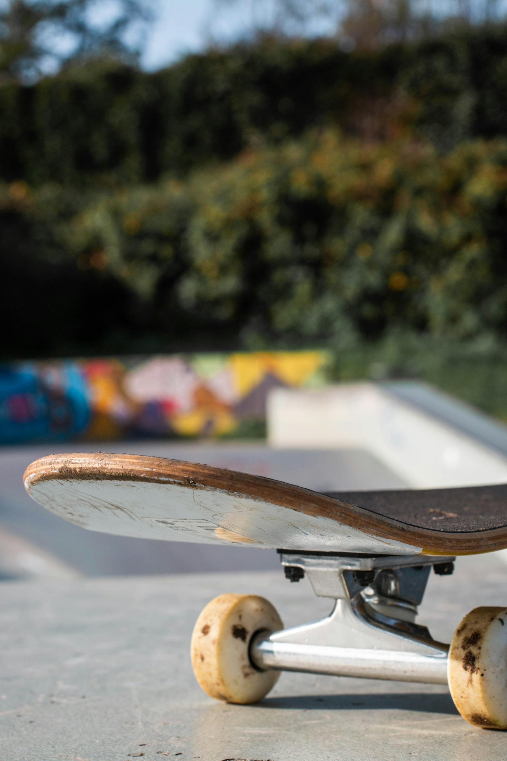 A closeup of the front trucks on a skateboard
