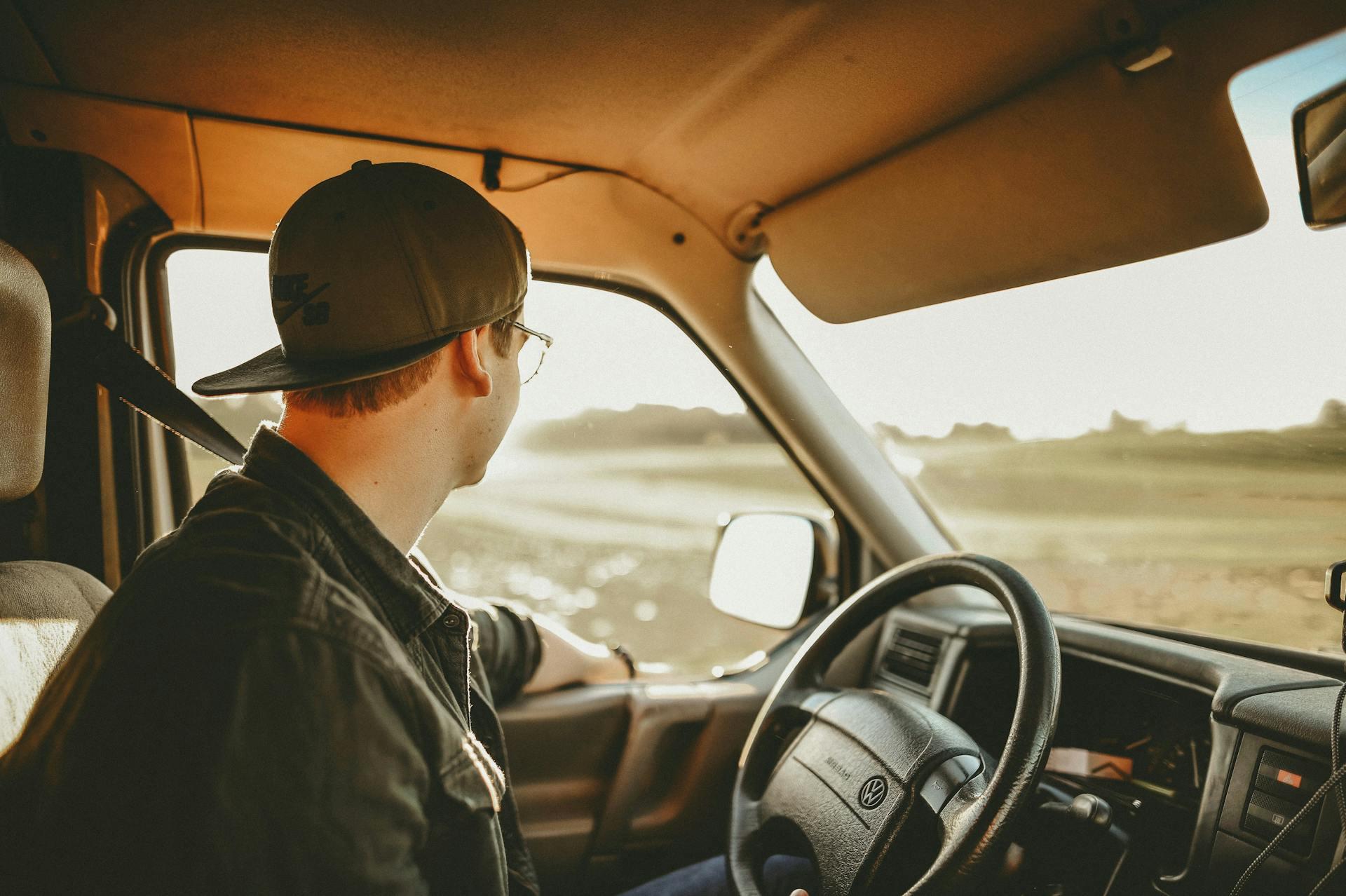 A young man driving a truck