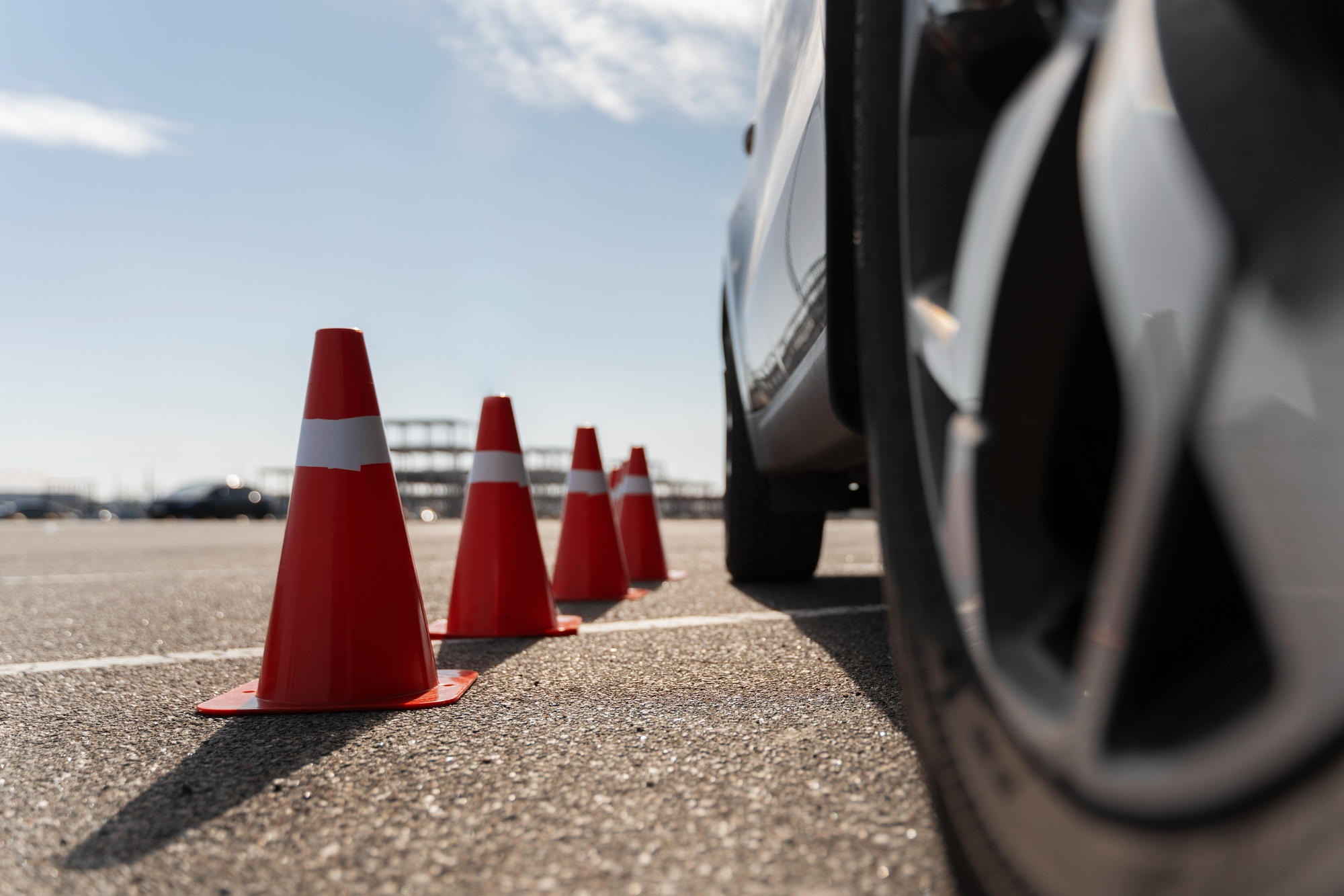 Car driving next to traffic cones for practice