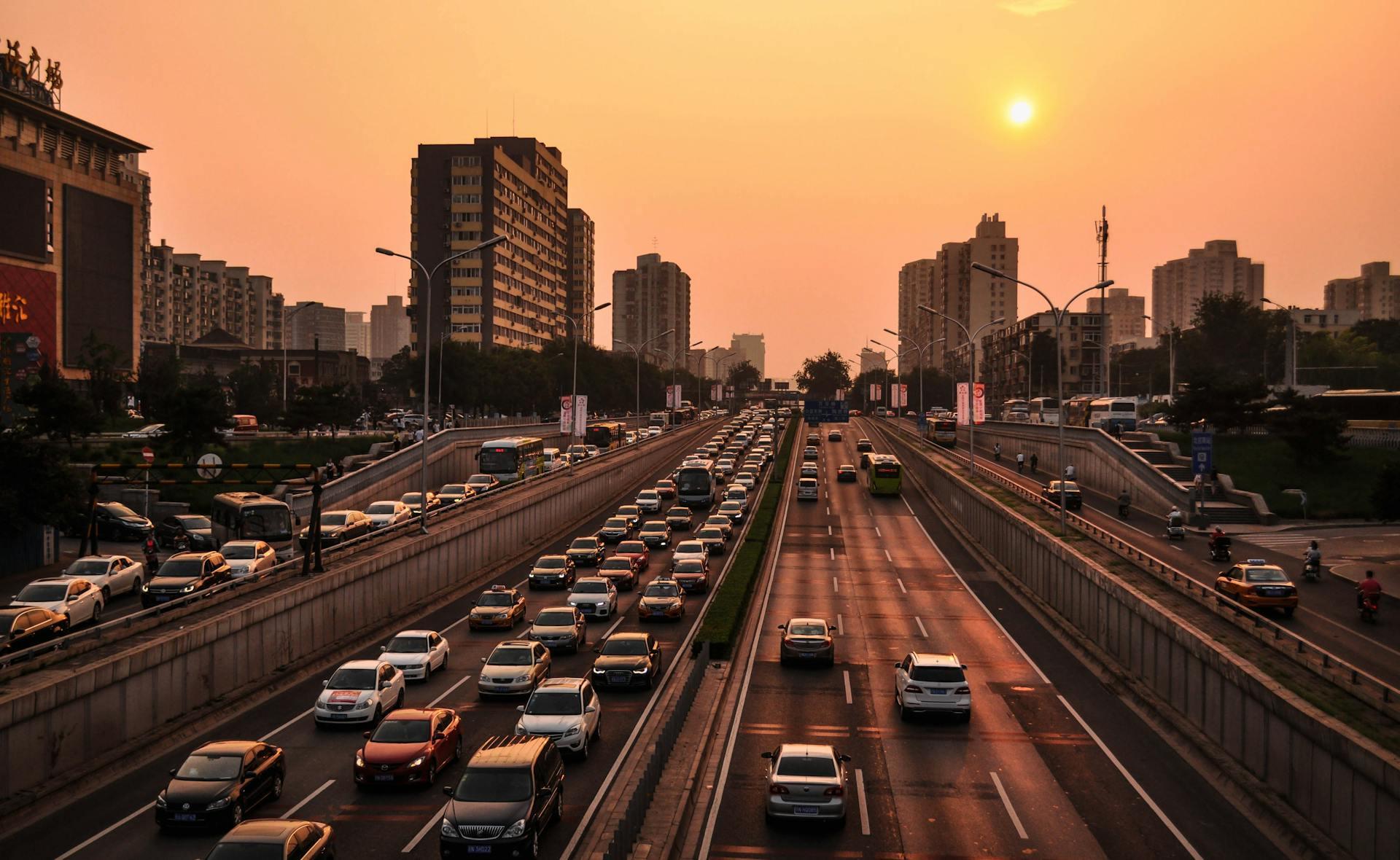 Cars driving on a highway at golden hour