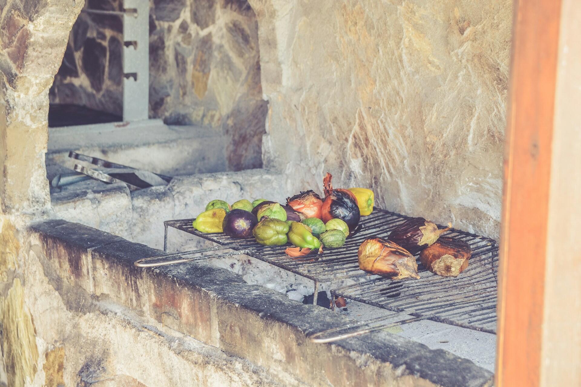 Vegetables roasting over a fire.
