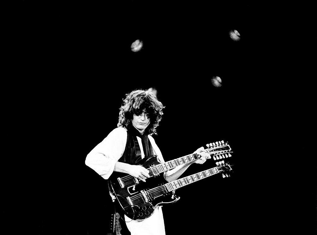Jimmy Page performing on stage.