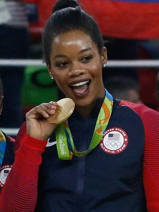 Gabby Douglas with her gold medal in the 2016 Rio Olympics.