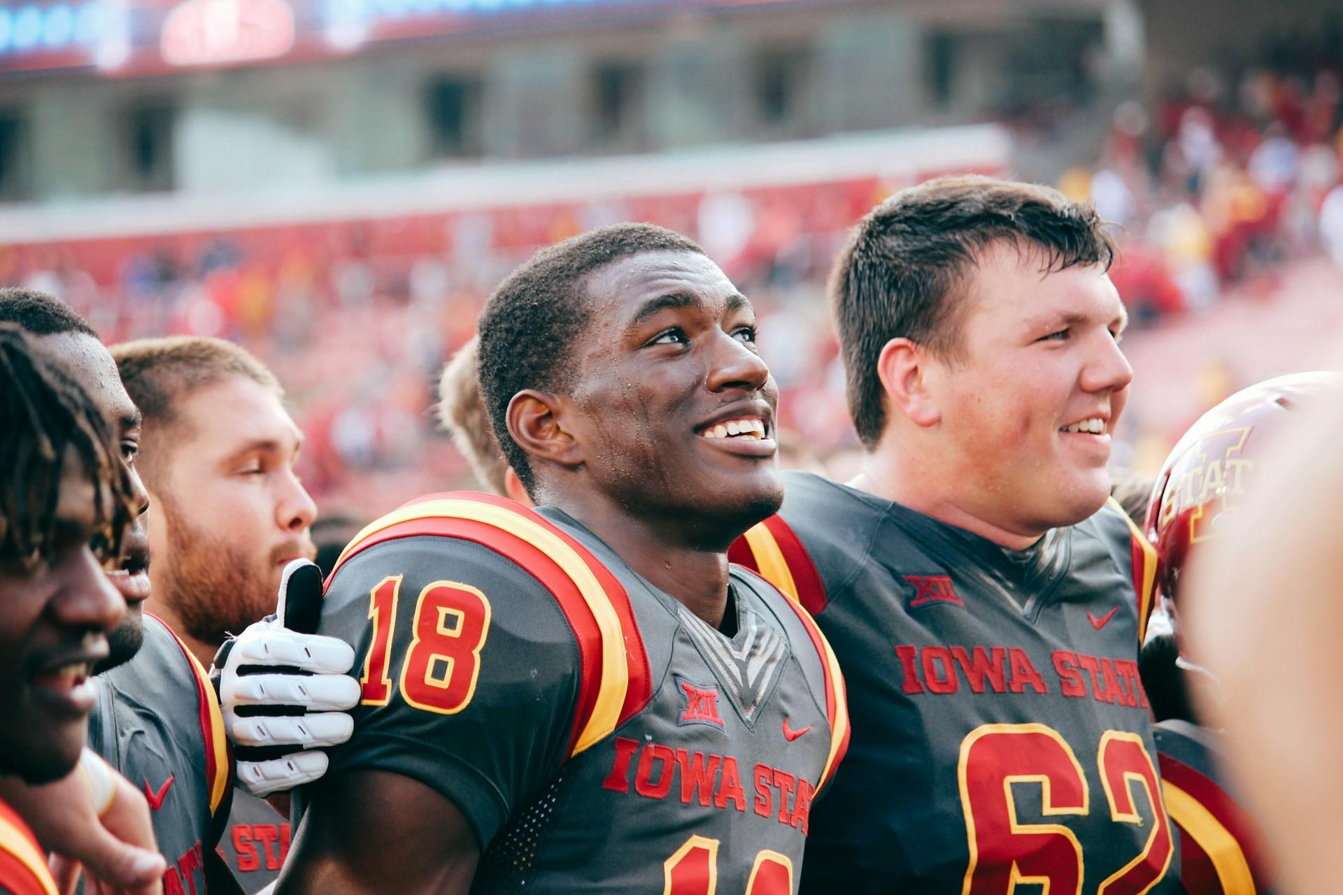 Iowa State student-athletes on the football field