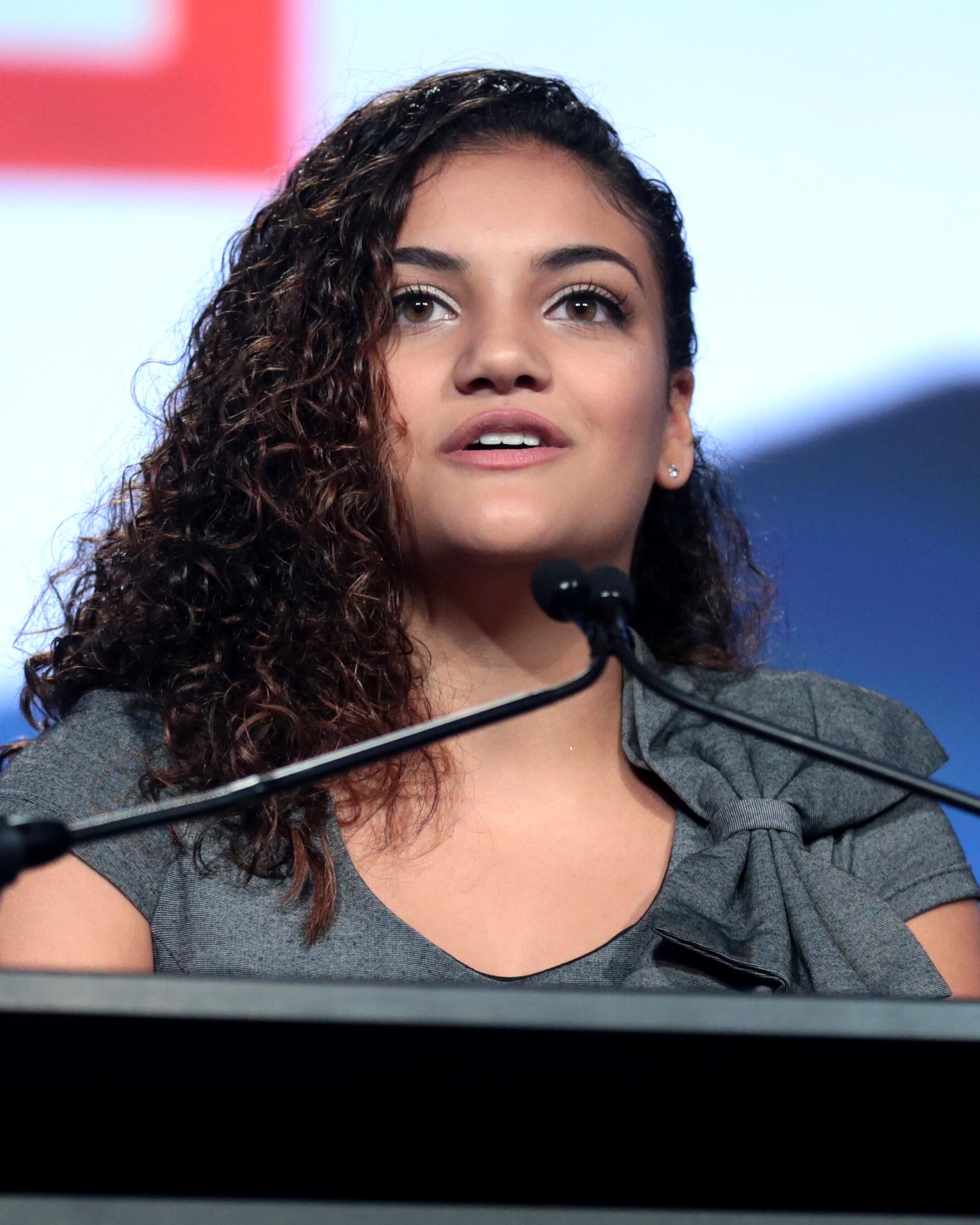 Laurie Hernandez speaking into a microphone.