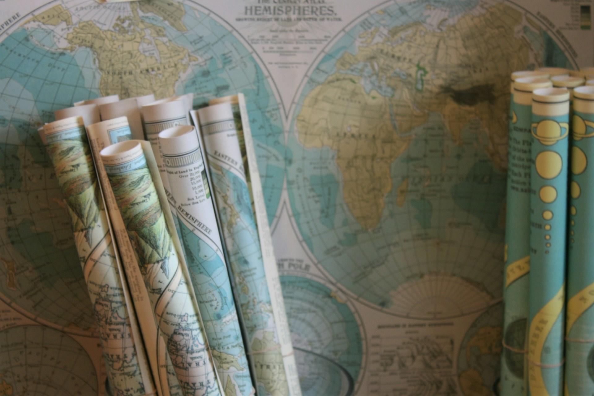 Maps rolled up and one on the table