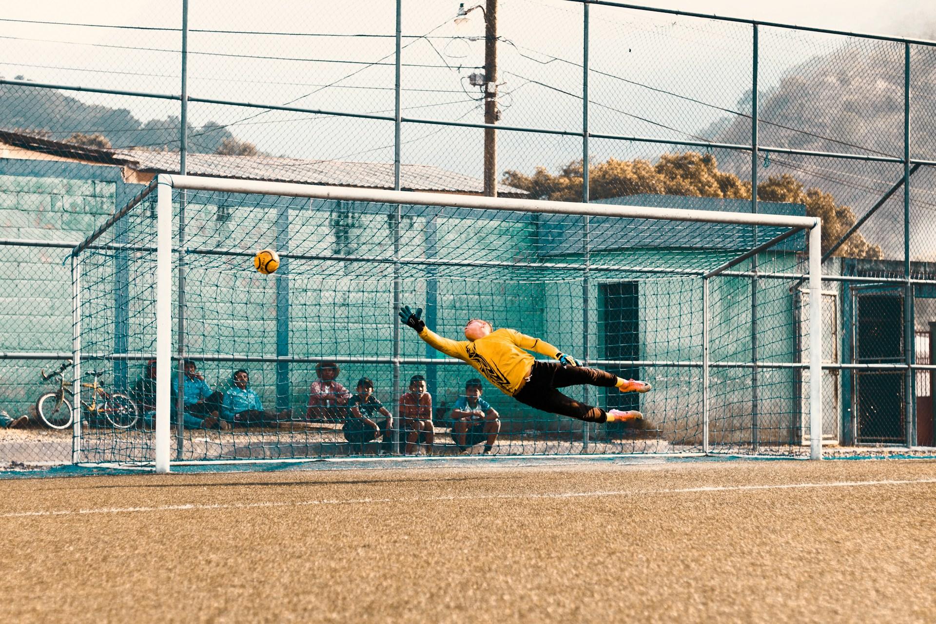 A soccer goalie in action.