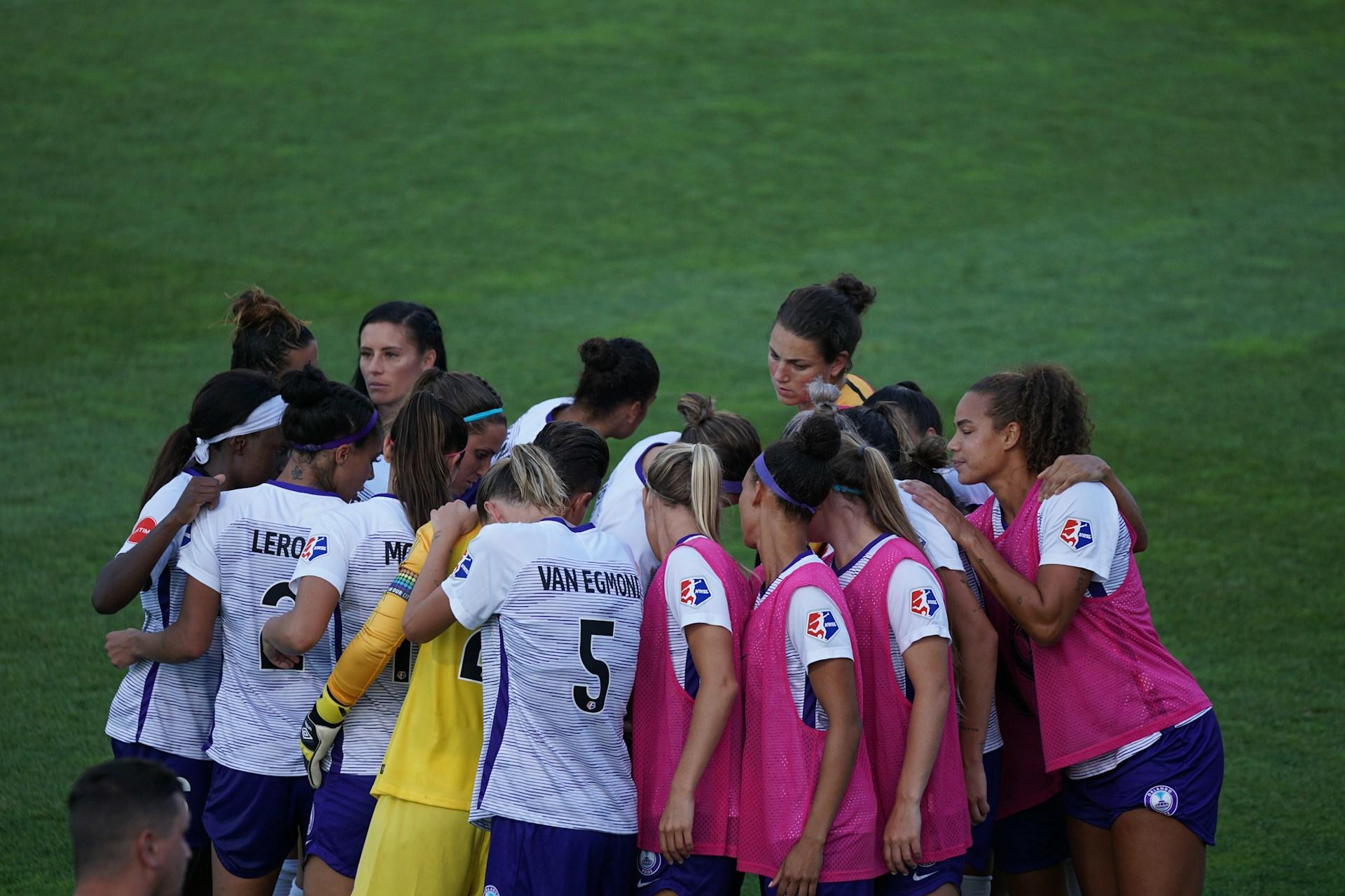 Women's soccer team cheer.