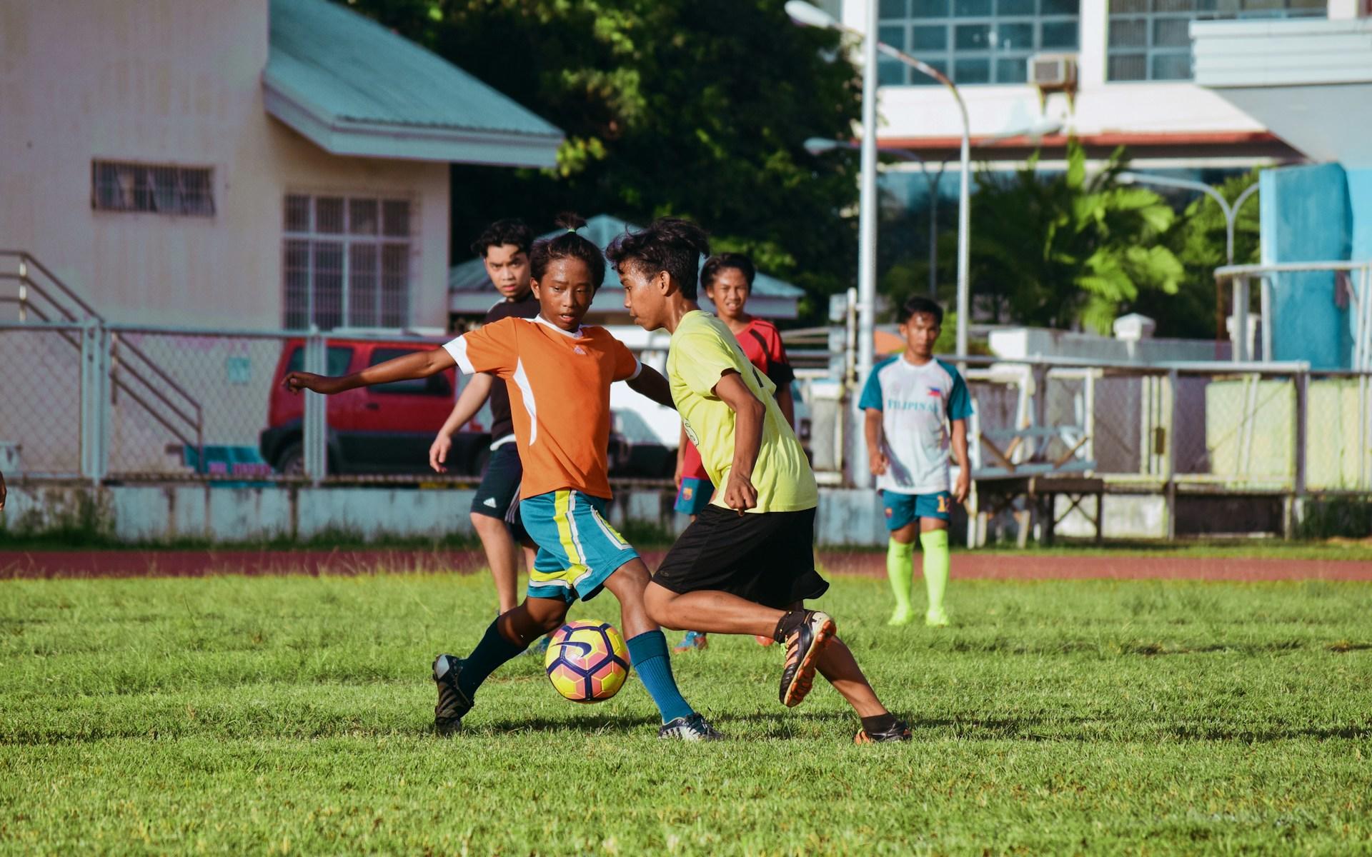 Kids playing soccer.