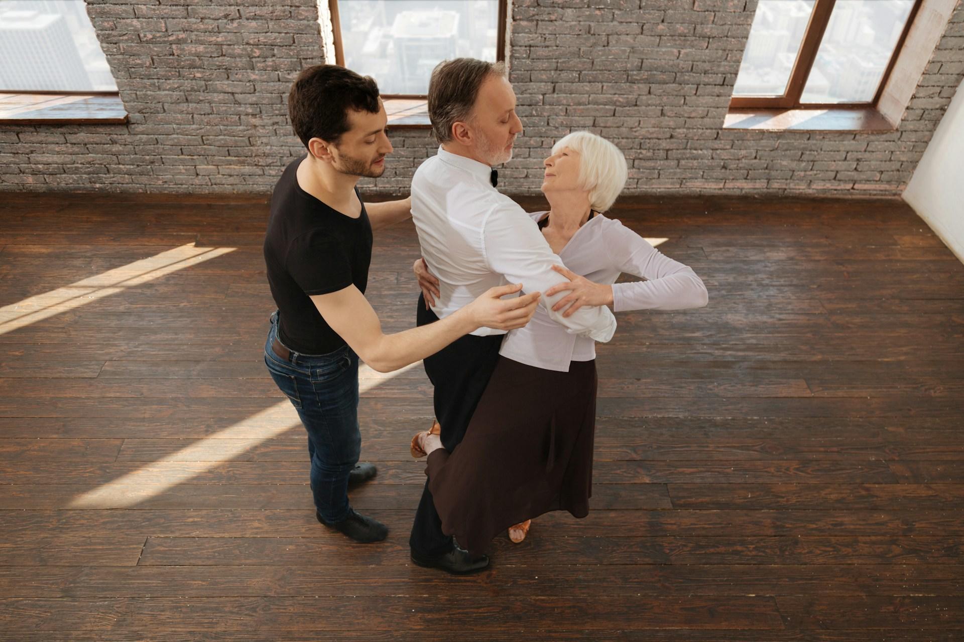 A couple taking lessons to learn the waltz.