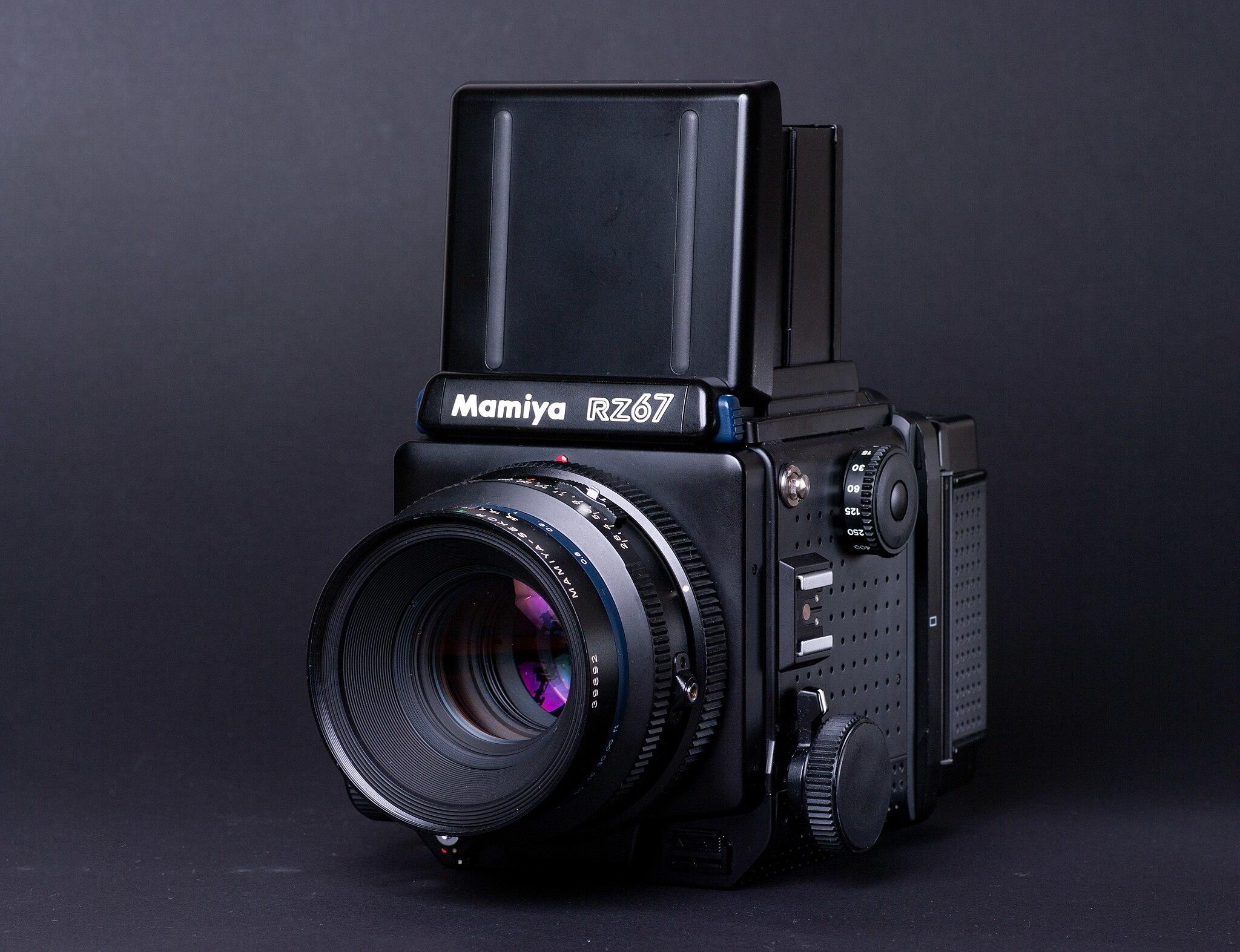 Mamiya RZ67 film camera on black background.